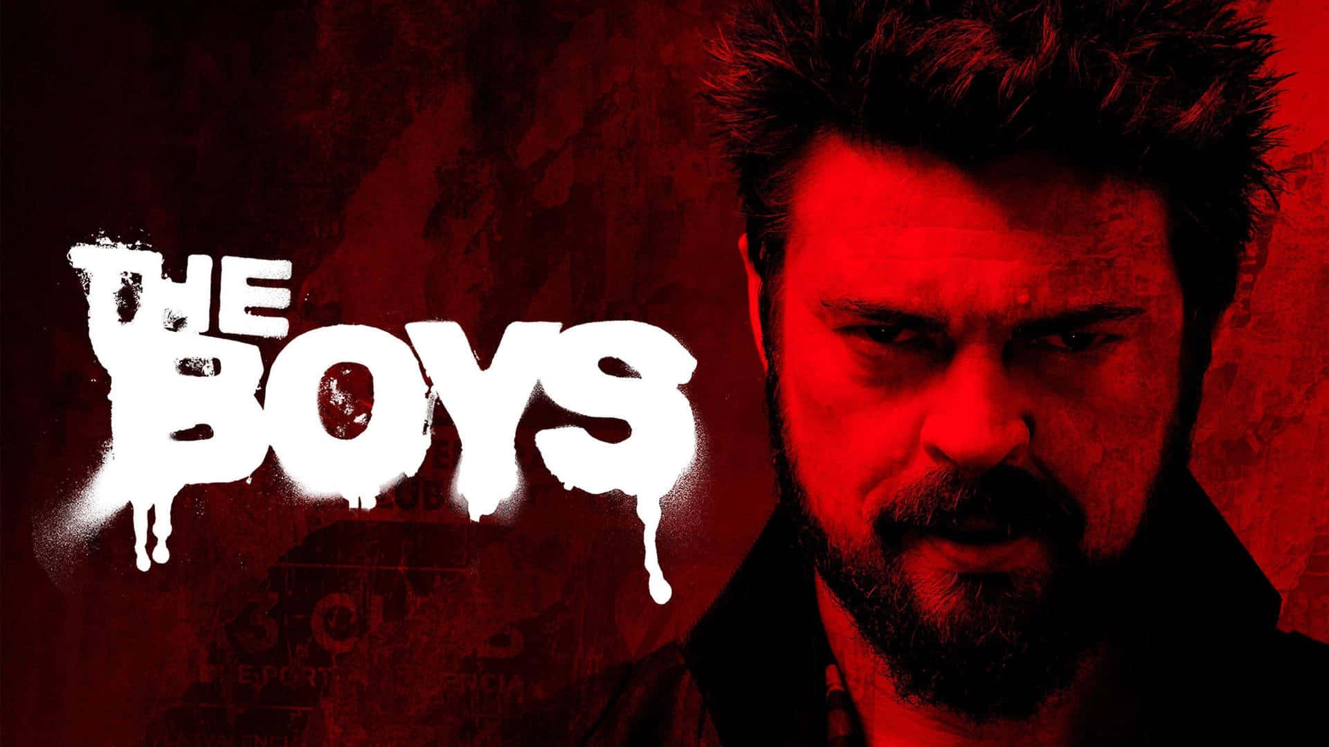  壁紙 — 一個留鬍子的男人在紅色燈光下，旁邊是塗鴉風格的標題「THE BOYS」，他凝視著，眼神強烈。