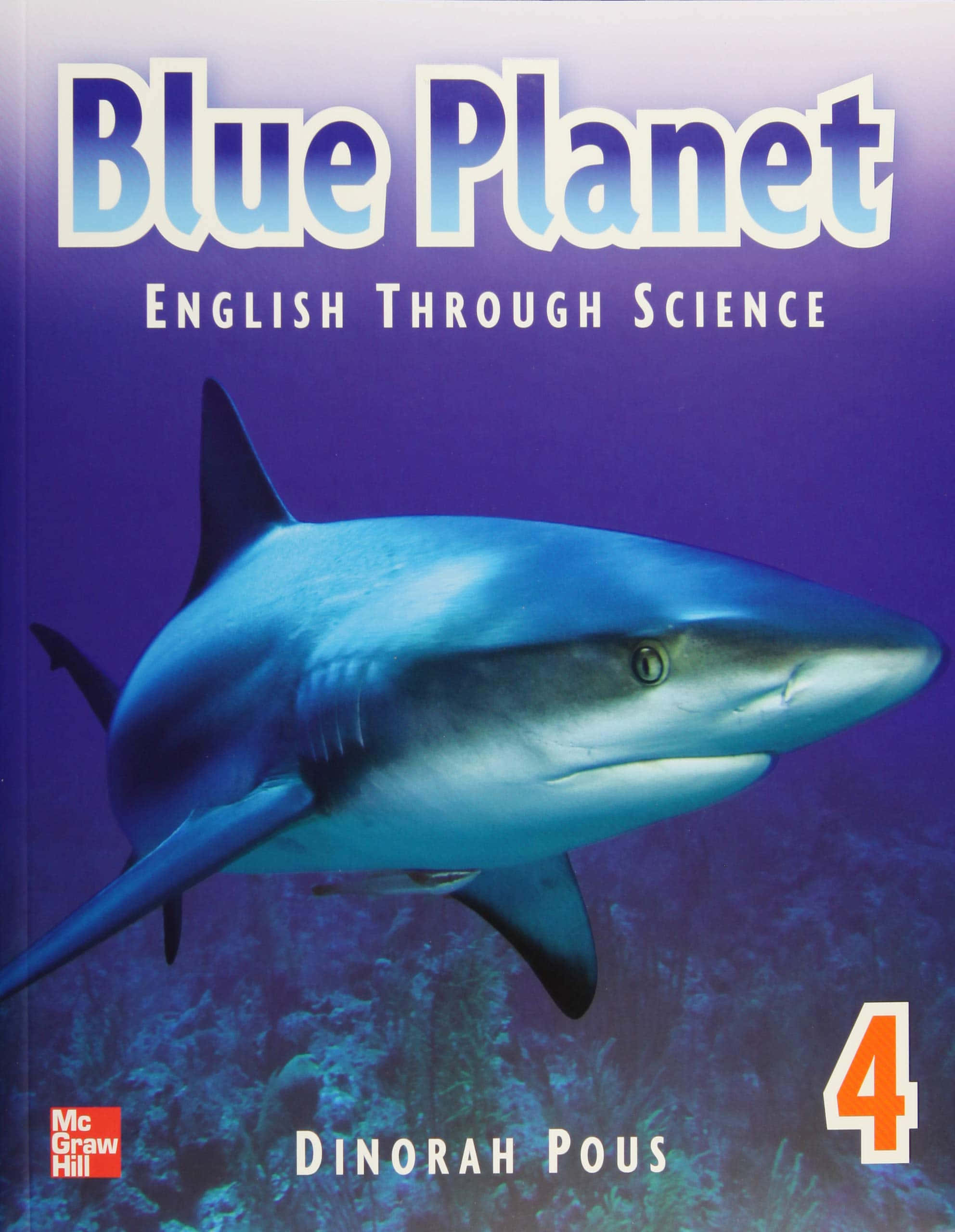 Blue Planet 桌布 壁紙 — 一條藍鯊在深紫色海洋背景下優雅地游動，出現在名為 Blue Planet 的教科書封面上。