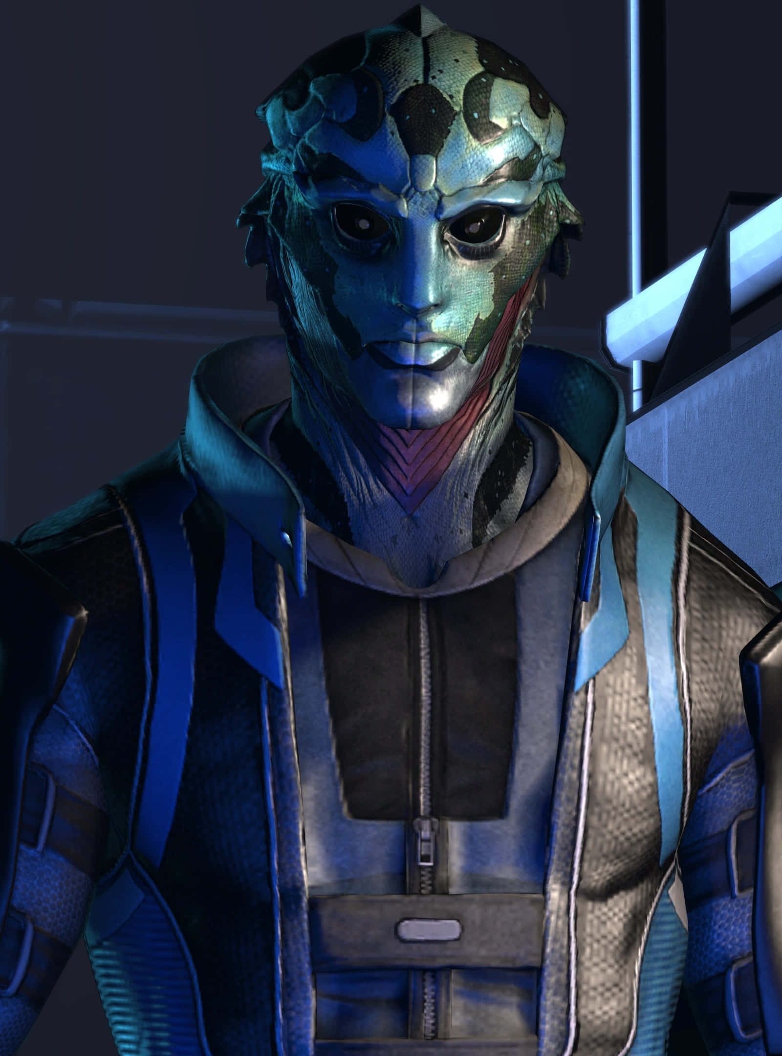 Thane Krios 桌布 壁紙 — 一個藍皮膚的外星人，有著紋理分明的臉龐和發光的眼睛，在未來主義的場景中向前凝視。