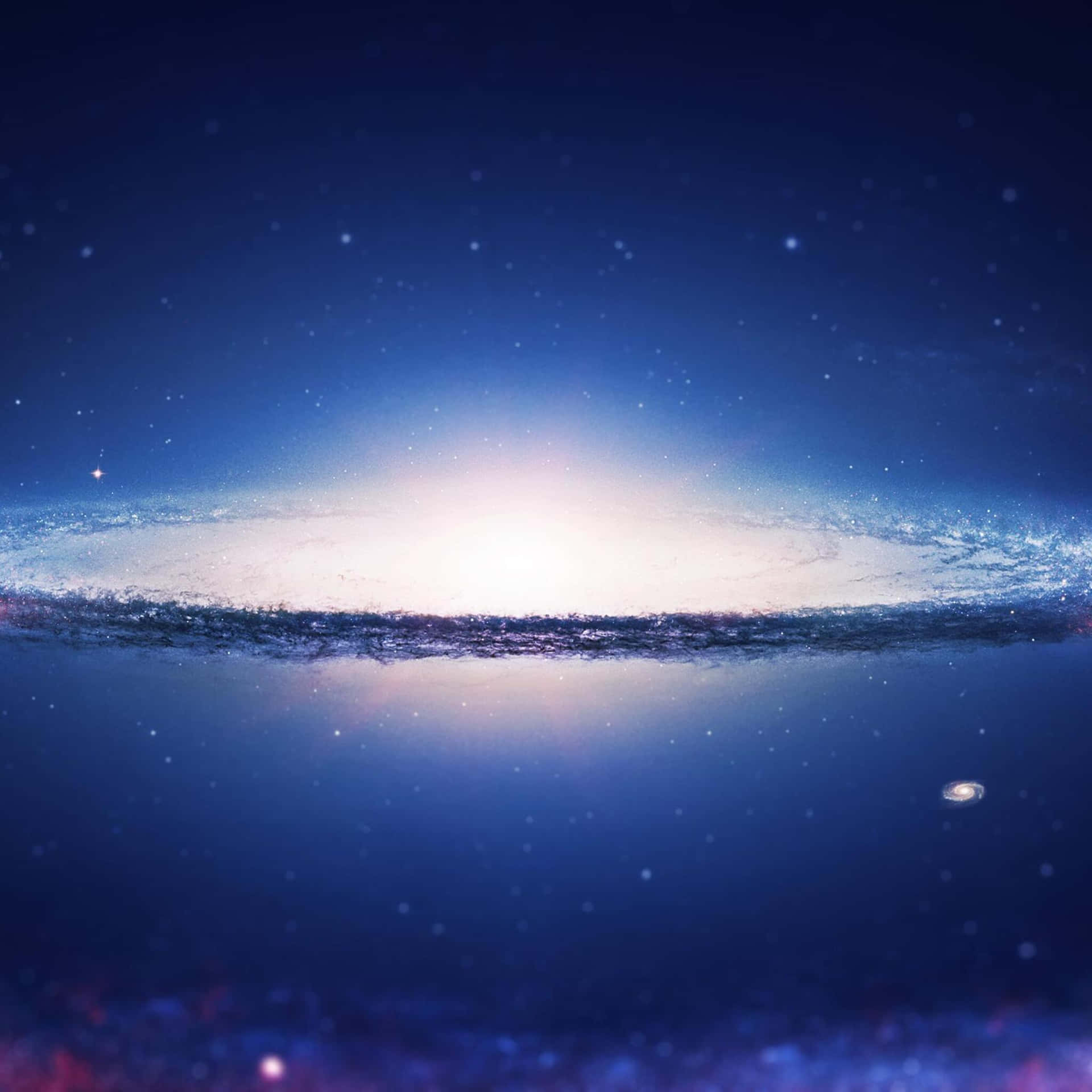  壁紙 — 一個令人嘆為觀止的螺旋星系景象，在深邃的宇宙藍色背景下散發出明亮的白色和藍色色調。