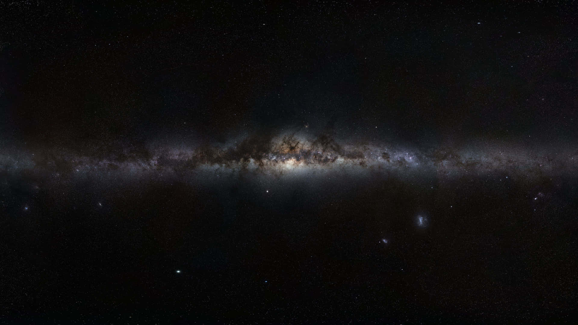 銀河系，帶有發光的星雲和黑暗的塵埃帶，背景是繁星點點的夜空。