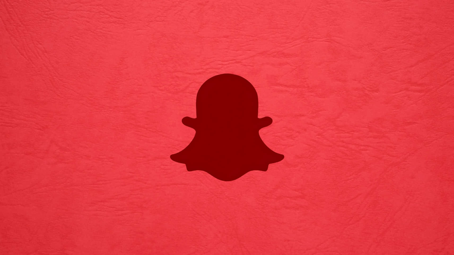  壁紙 — 一個深紅色Snapchat鬼魂標誌，居中在帶紋理的鮮紅色背景上。