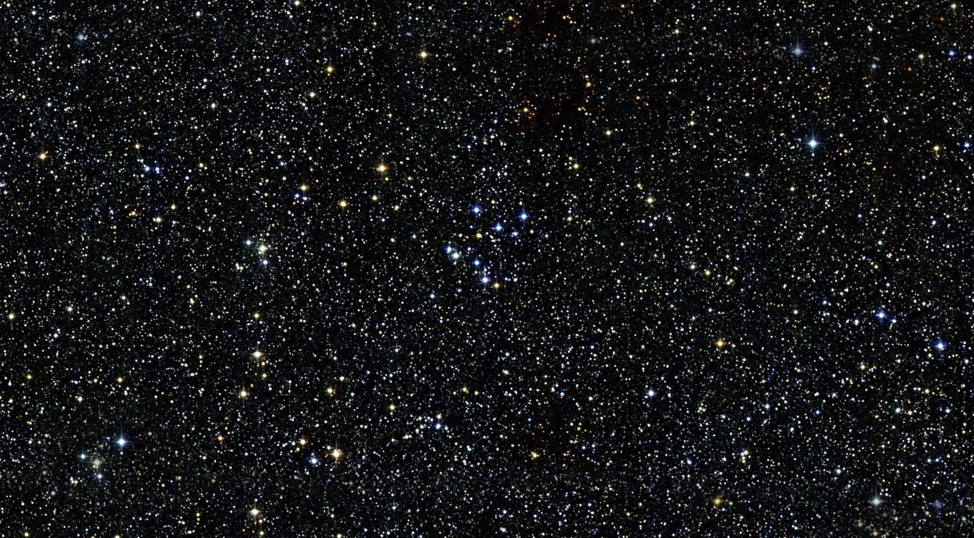 夜空中廣闊的星場，帶有藍色和黃色色調。