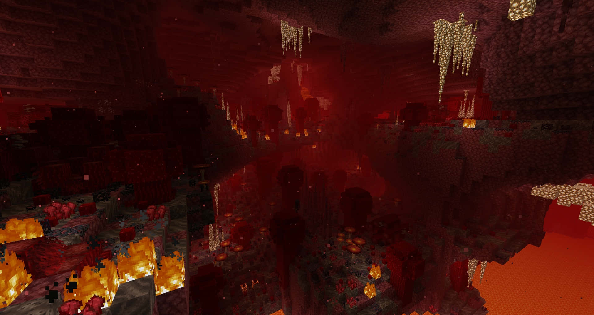  壁紙 — Minecraft 中一個熾熱的地獄洞穴，有發光的熔岩池和懸掛的地獄岩層，在紅色天空下。