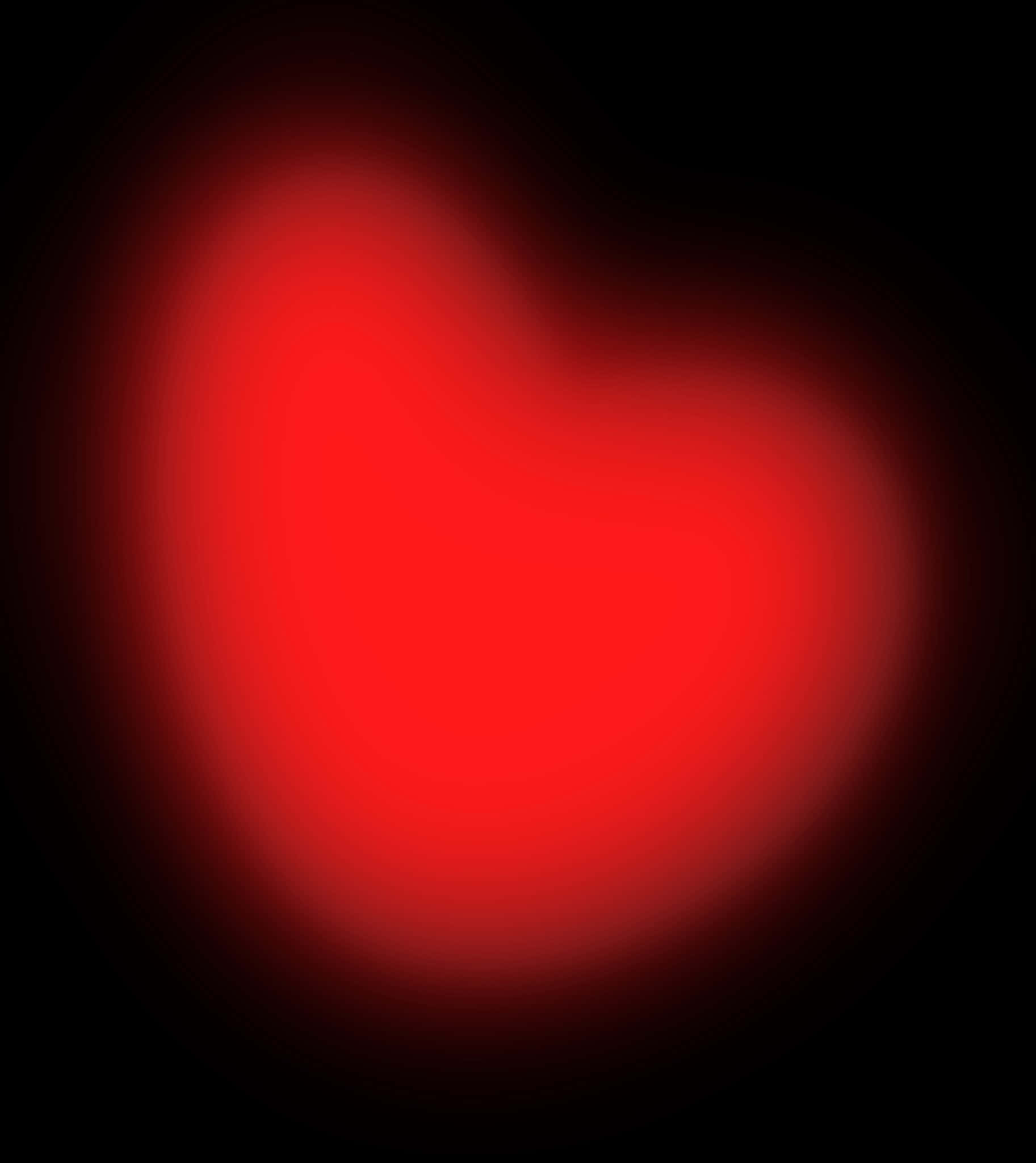 Blurry Heart 桌布 壁紙 — 一個發光的紅色心形在深黑色背景上柔和地散發光芒，帶有平滑的漸變邊緣。