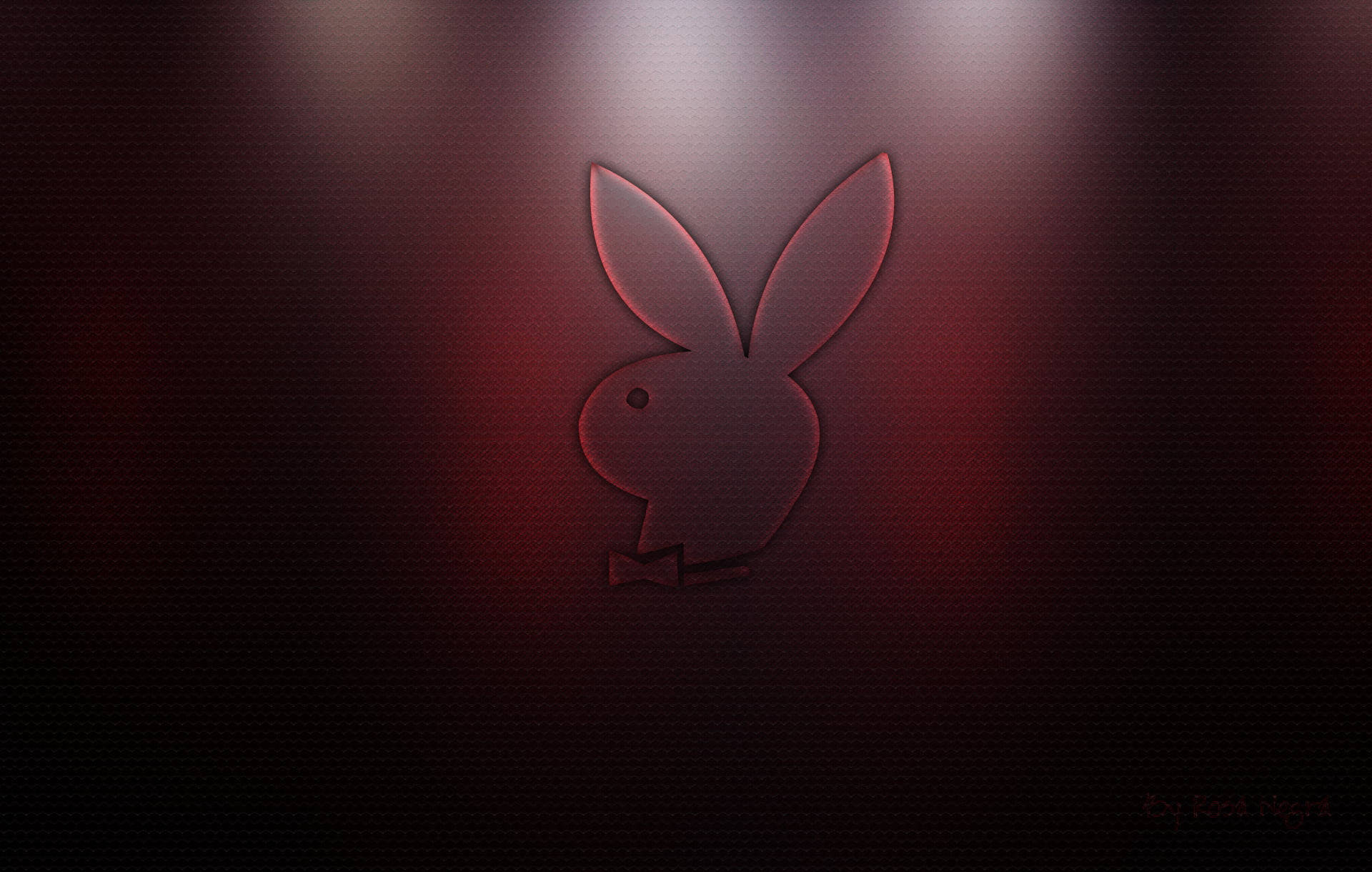 Playboy兔子標誌在深色紋理背景上發出紅光。