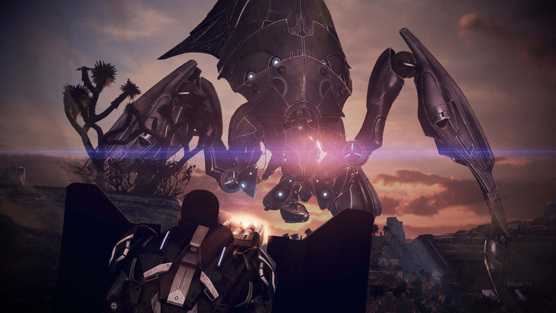 Mass Effect Legendary Edition 桌布 壁紙 — 一個孤獨的裝甲身影，在火紅的夕陽天空下，面對一個高聳的機械怪物。