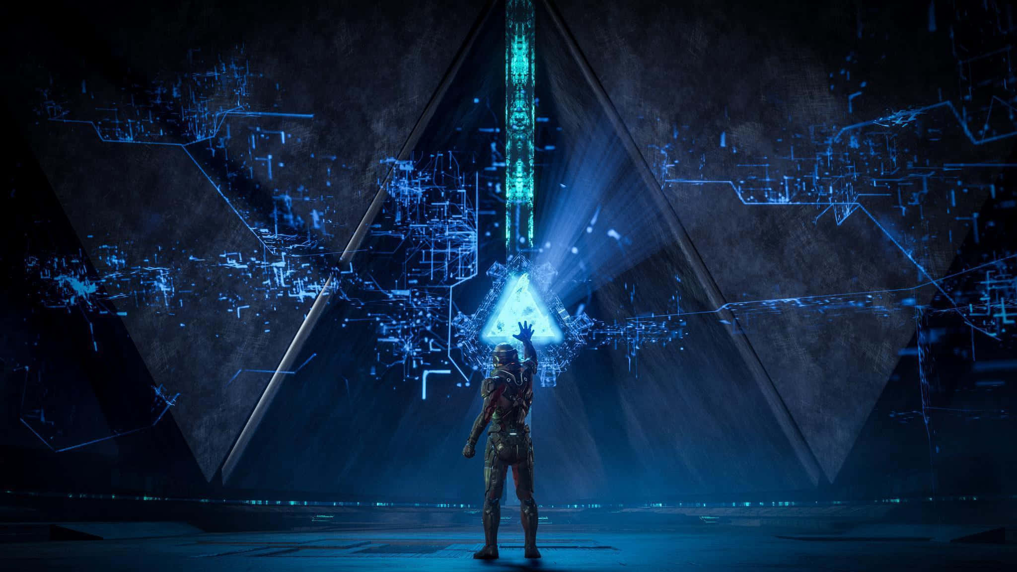 Mass Effect Andromeda 桌布 壁紙 — 一個孤獨的裝甲人物站在黑暗的房間中，伸手觸摸一個被數字電路包圍的發光藍色三角形全息圖。