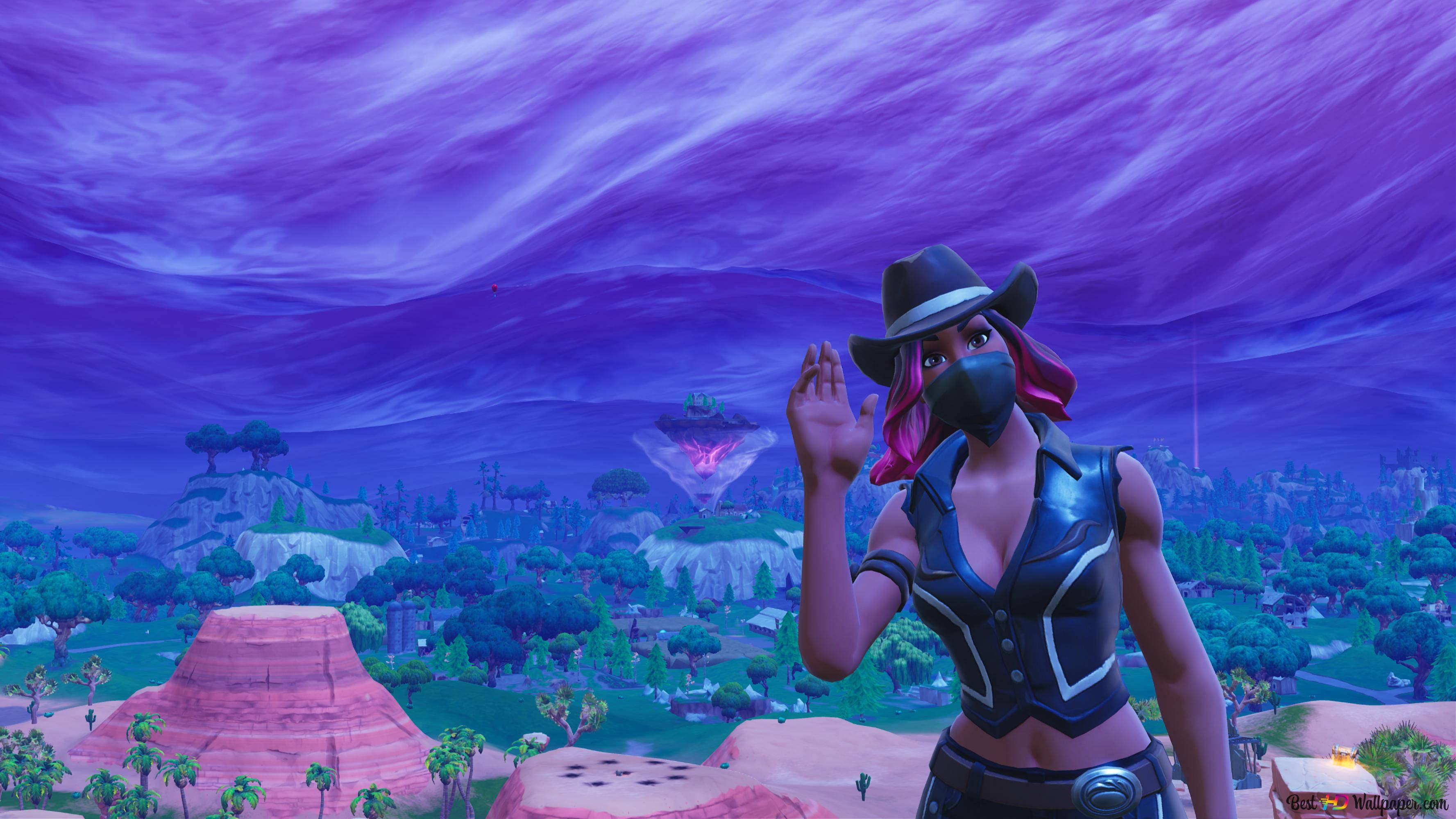 《Fortnite》災難皮膚桌面壁紙 壁紙 — 一個戴著牛仔帽的面具角色在超現實的紫色天空下，在充滿活力的Fortnite景觀中揮手。
