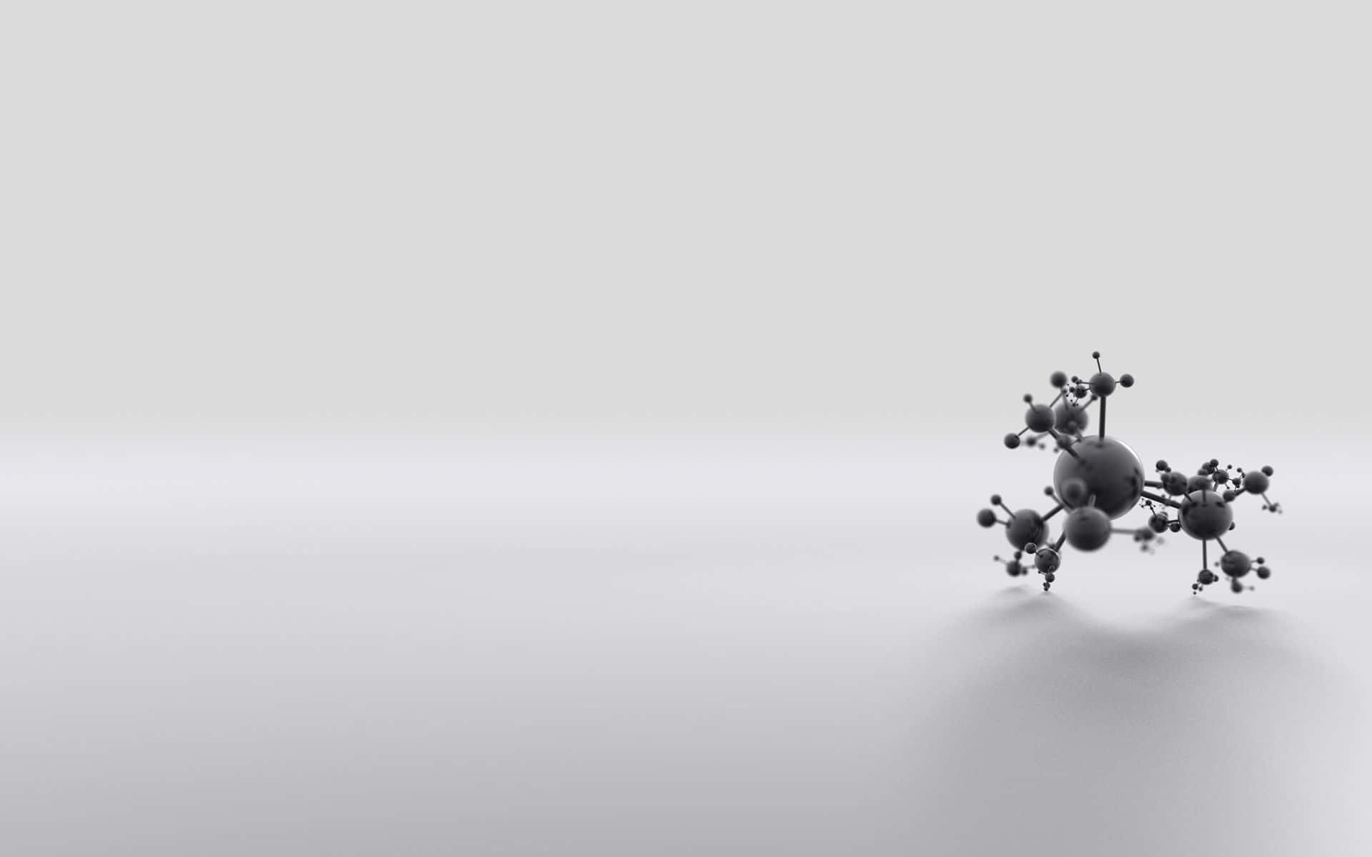 一個灰色3D分子模型在純色表面上。