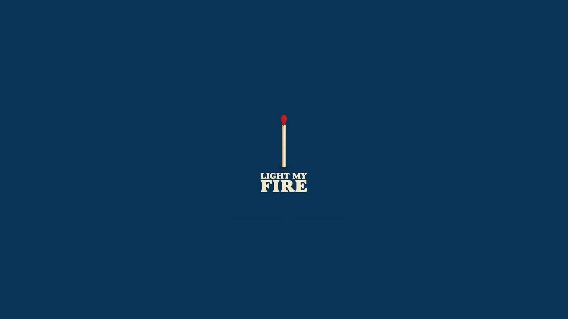  壁紙 — 一根紅色頭的火柴居中放置在深藍色背景上，下方有文字 'LIGHT MY FIRE'。