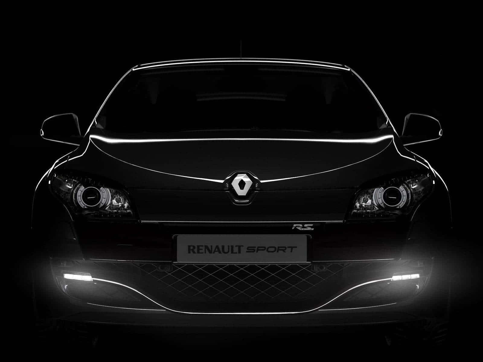 Renault Scenic 桌布 壁紙 — 黑色雷諾運動車的時尚前視圖，在黑暗背景下由發光的車頭燈照亮。