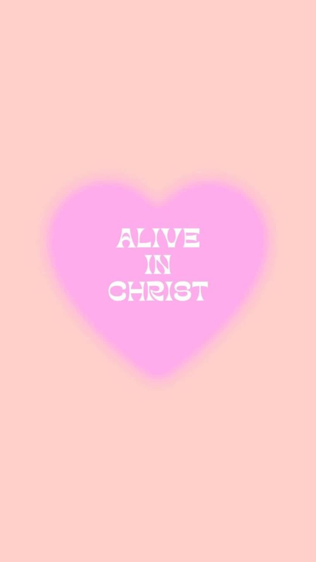 粉紅色心形，白色文字寫著「Alive in Christ」，置於粉彩色粉紅色背景上。 — 粉紅色心形動圖 壁紙
