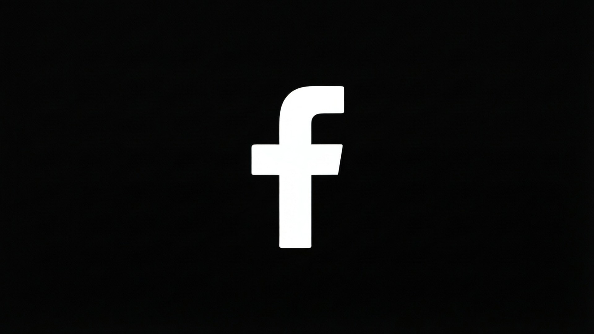 桌布 壁紙 — 一個鮮明的白色Facebook標誌，居中放置在純黑色背景上，沒有其他元素。