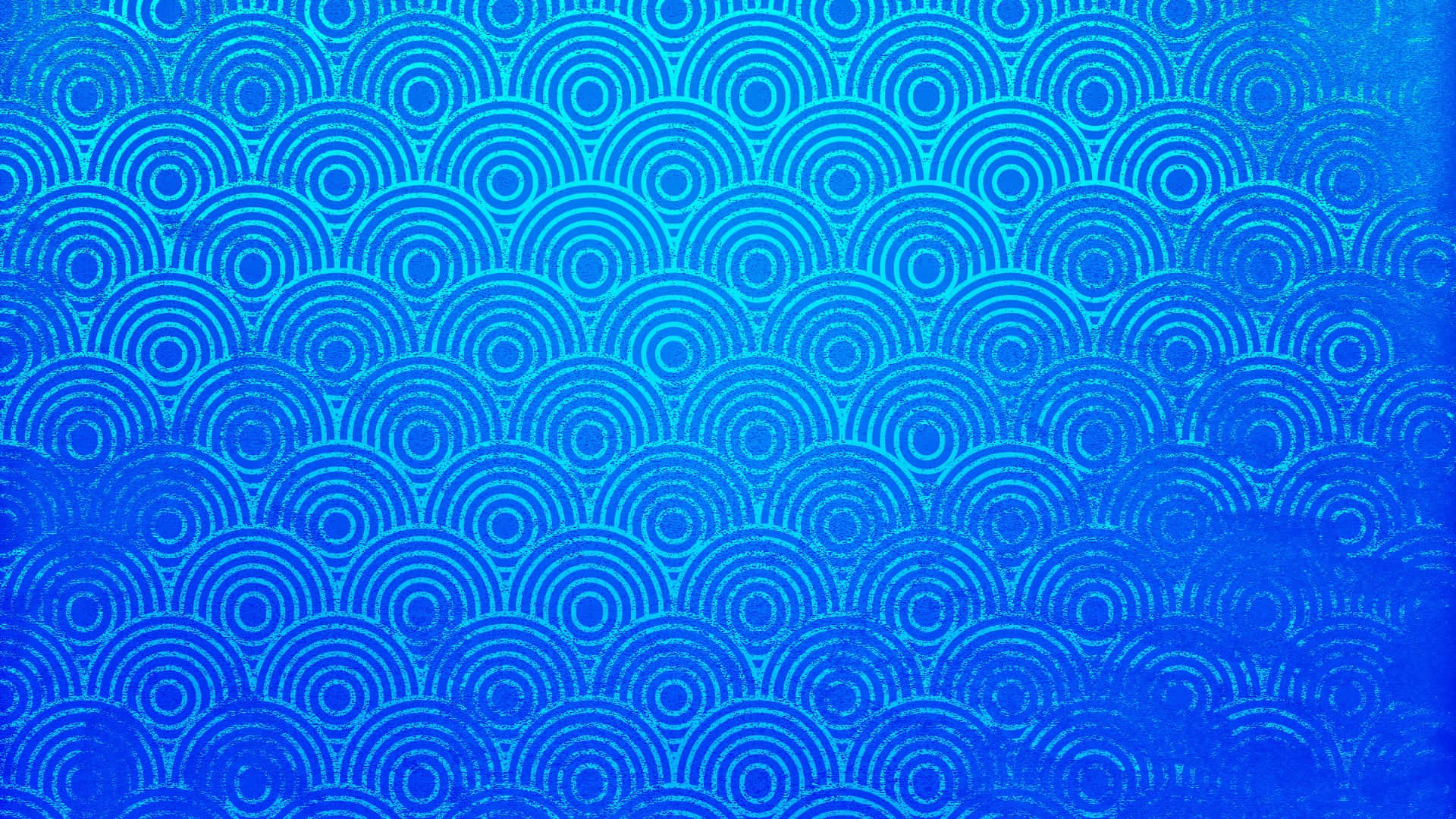  壁紙 — 充滿活力的藍色牆紙，以波浪狀排列重複的同心圓圖案。