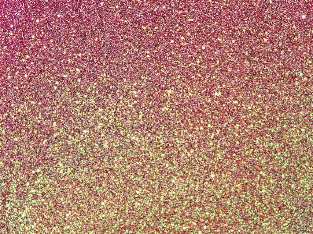  壁紙 — 從粉紅到金色的閃粉充滿活力的漸變，密集地覆蓋整個畫面。