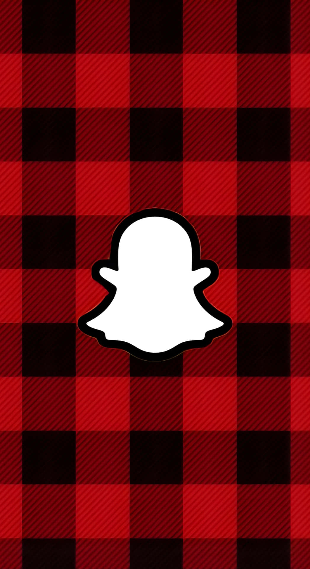  壁紙 — 白色Snapchat鬼魂標誌居中在帶有對角線紋理的醒目紅黑格子背景上。