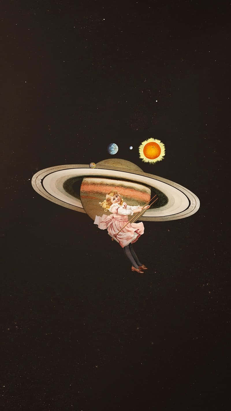  壁紙 — 一個穿著粉紅色連衣裙的小女孩漂浮在土星旁邊，手持一根杖，太陽和月亮在附近的星空虛空中環繞。
