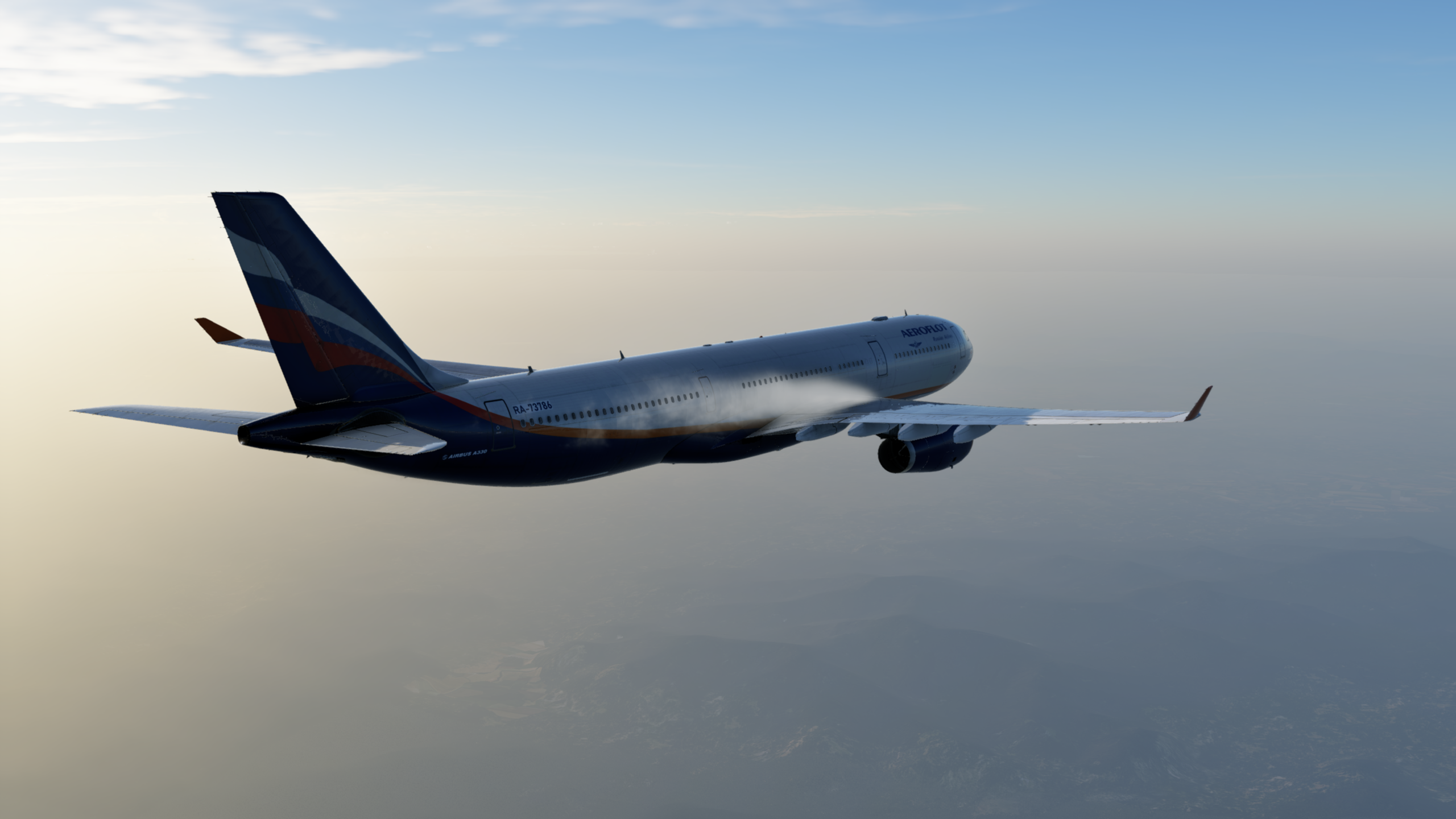 空中巴士A330黃昏飛行 壁紙 — 卡塔爾航空的空中巴士A330在黎明時分優雅地翱翔於朦朧景觀之上，柔和的金色光芒沐浴著機身。