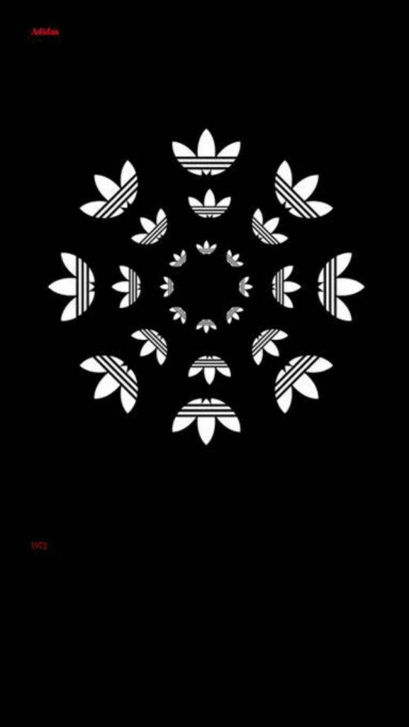 Adidas iPhone 標誌圓形排列 壁紙 — 黑色背景上有一個對稱的白色Adidas標誌曼陀羅，帶有重複的三葉草圖案向外輻射。
