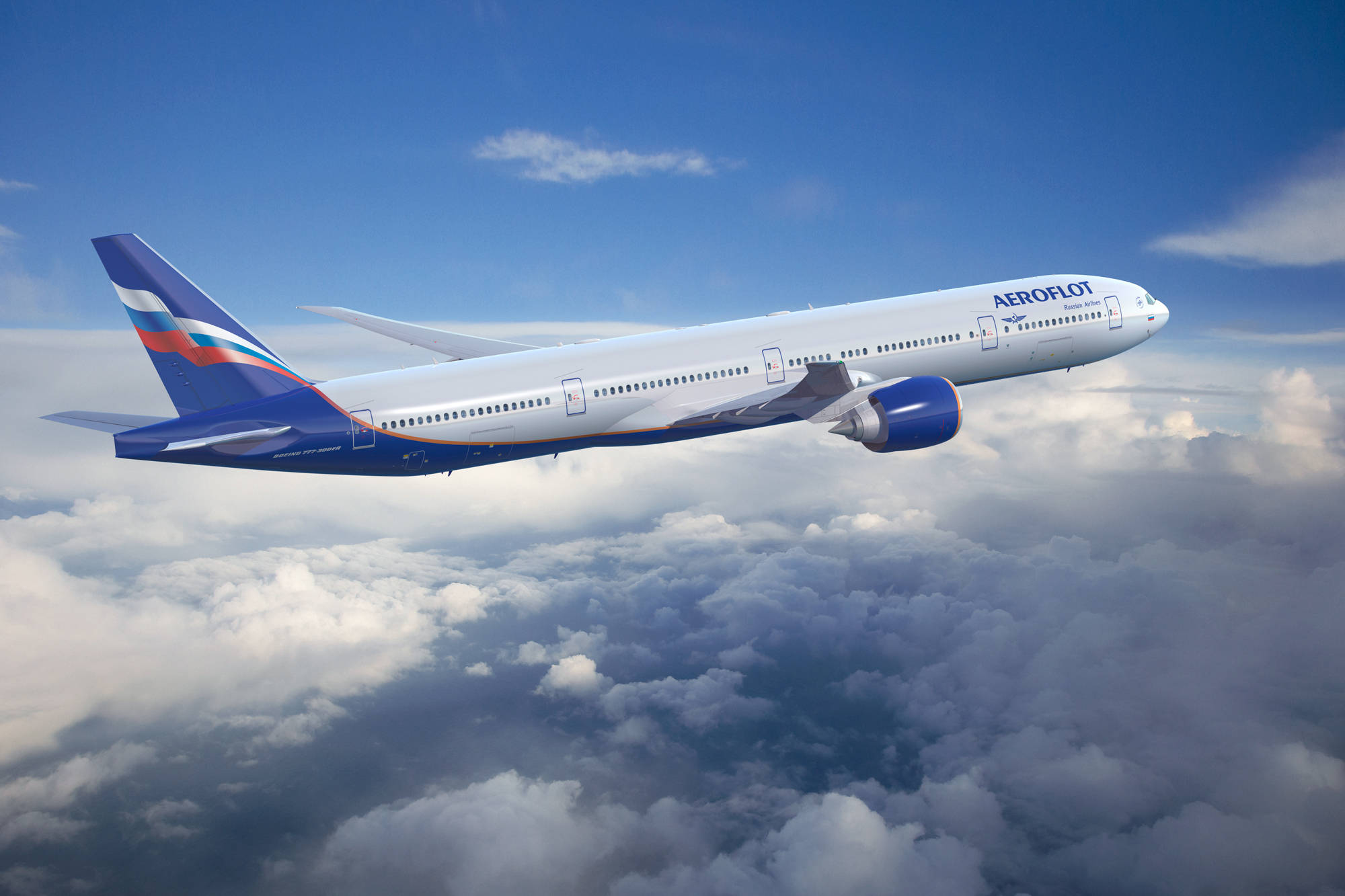 雲層中的 Aeroflot 飛機 壁紙 — 一架俄羅斯航空飛機在晴朗藍天下翱翔於蓬鬆白雲之上。