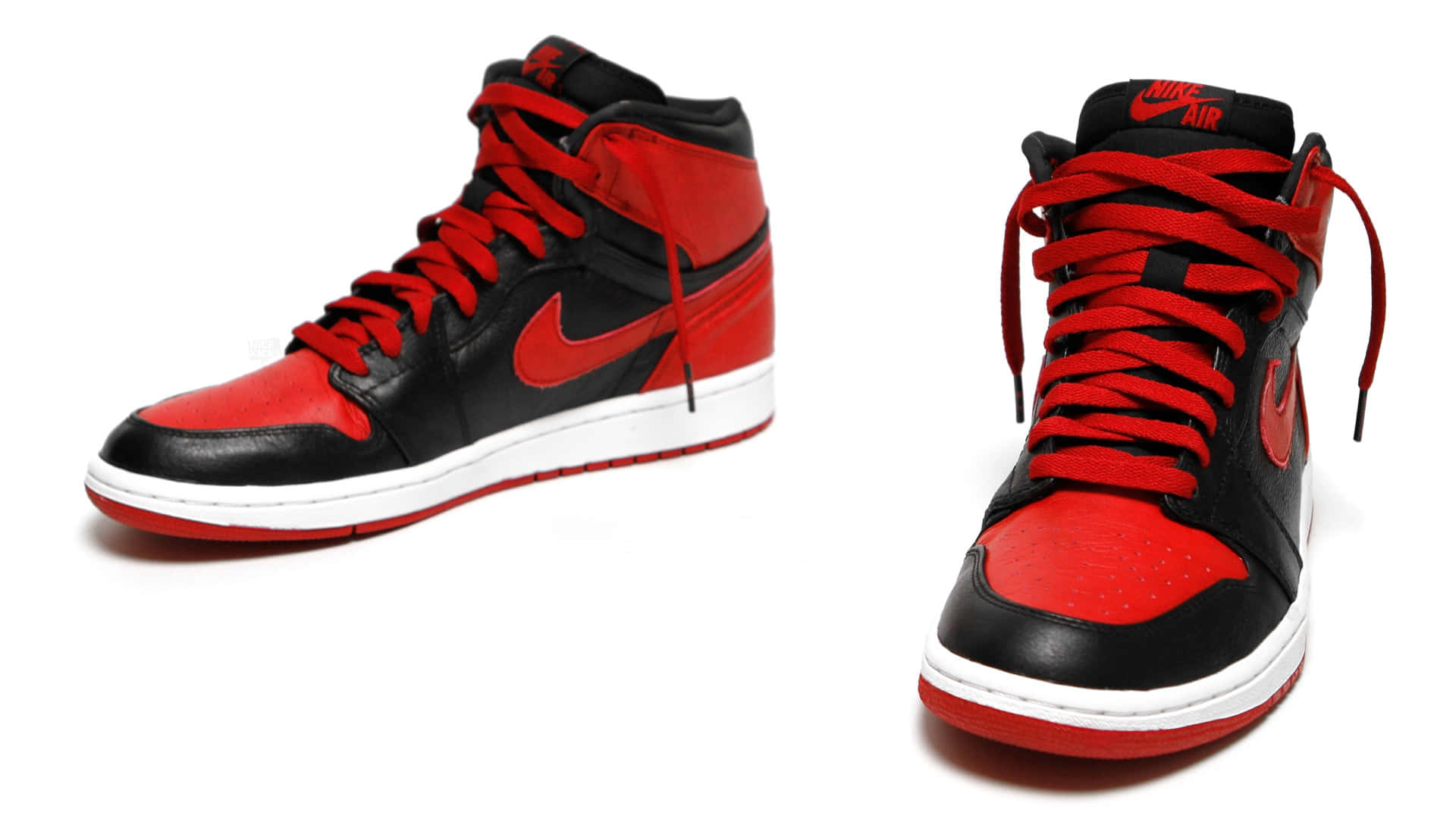 黑色和紅色的Nike Air Jordan 1高筒運動鞋，白色鞋底。