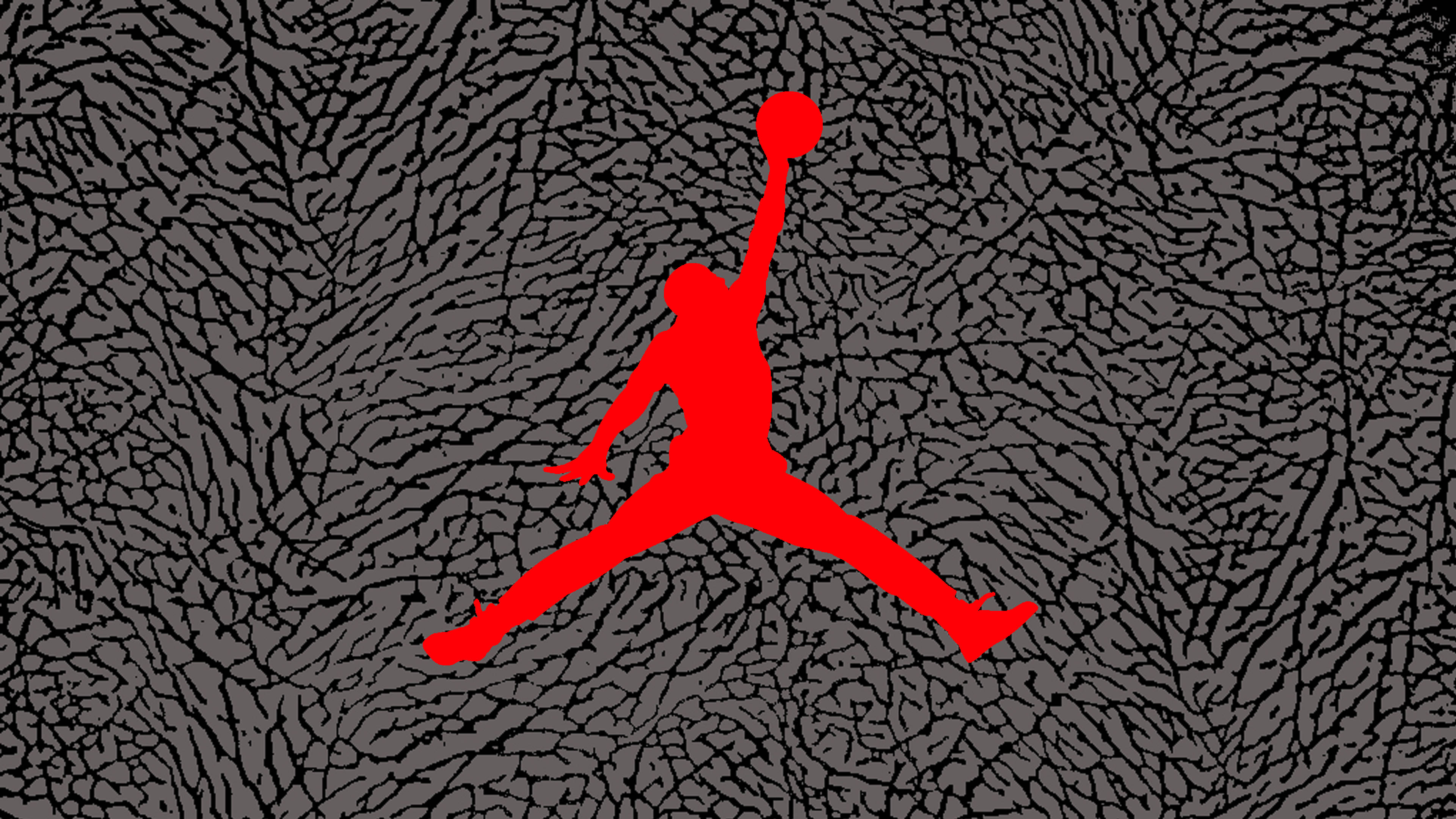 Air Jordan 象紋印花 壁紙 — 一個大膽的紅色剪影，描繪一名籃球運動員在半空中持球，背景為帶紋理的灰色。