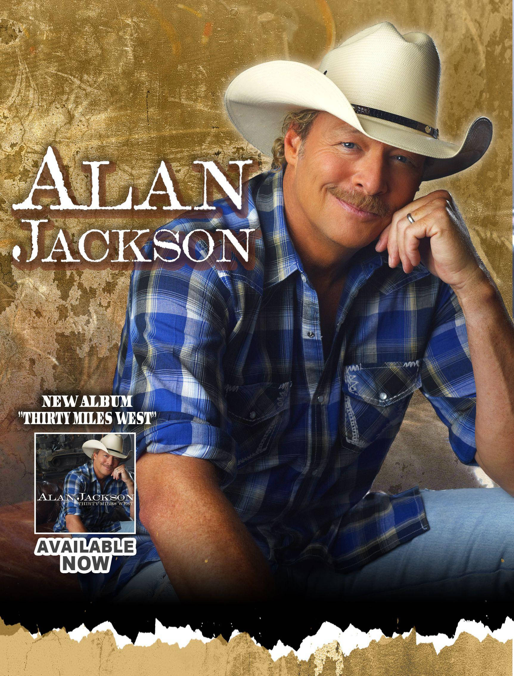 Alan Jackson 桌布 壁紙 — Alan Jackson 戴著牛仔帽和藍色格仔恤衫，在帶有紋理的金色背景前溫暖地微笑，宣傳他的新專輯。