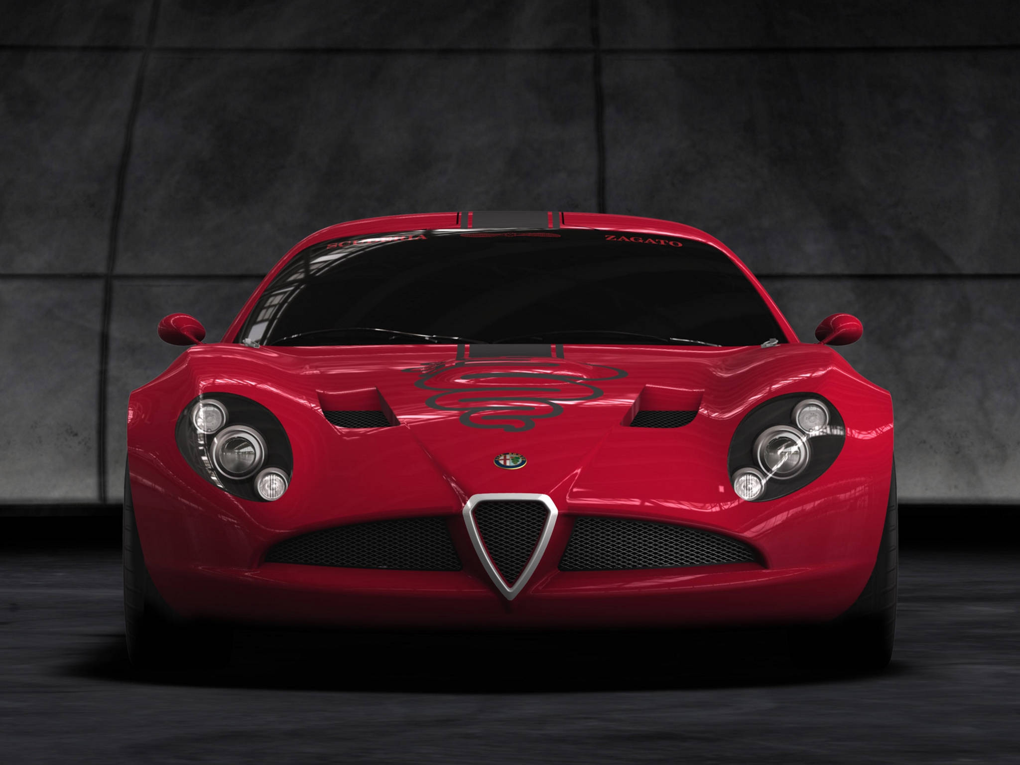Alfa Romeo iPhone正面視角 壁紙 — 一輛光亮的紅色愛快羅密歐 Zagato 跑車在光線昏暗的混凝土車庫中，以戲劇性的燈光正面朝前。