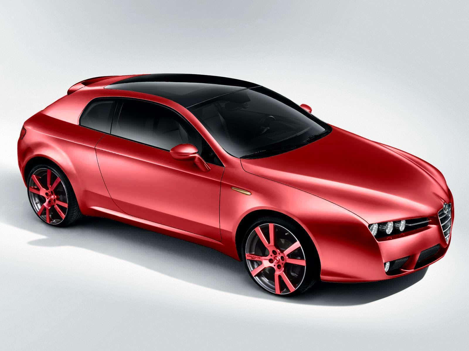 Alfa Romeo，自首次賽車以來持續激發熱情 壁紙 — 一輛時尚的紅色跑車，配備黑色車頂和相配的紅色輪圈，在簡約的白色工作室背景中展示。