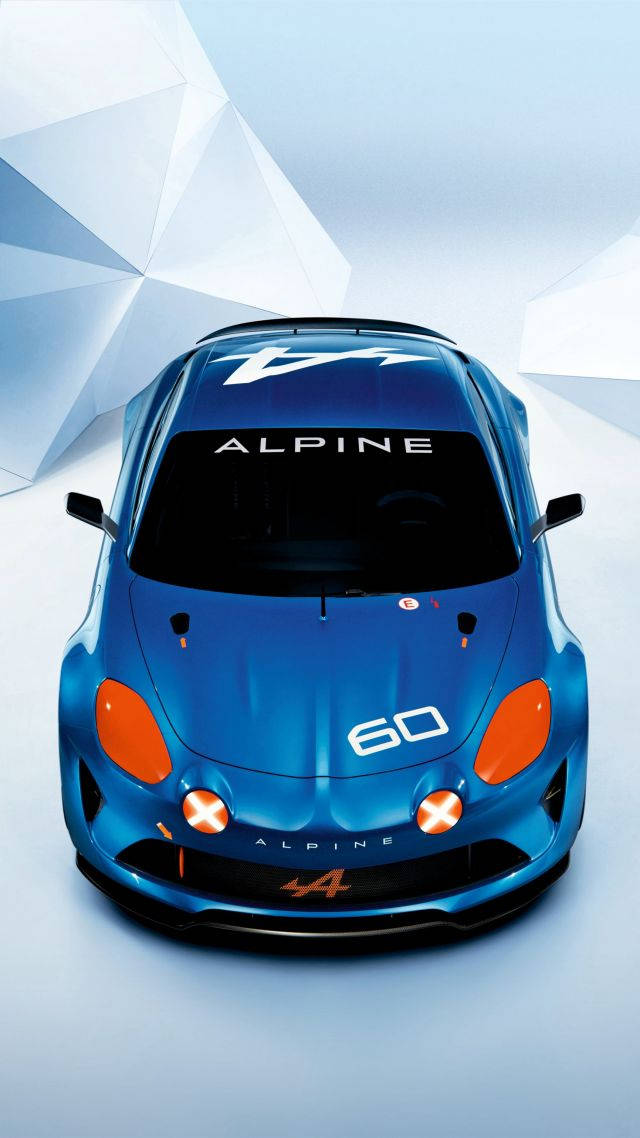 藍色Alpine鑄造模型車 壁紙 — 從上方俯瞰，一輛時尚的藍色Alpine A60跑車帶有橙色點綴，背景為幾何白色。