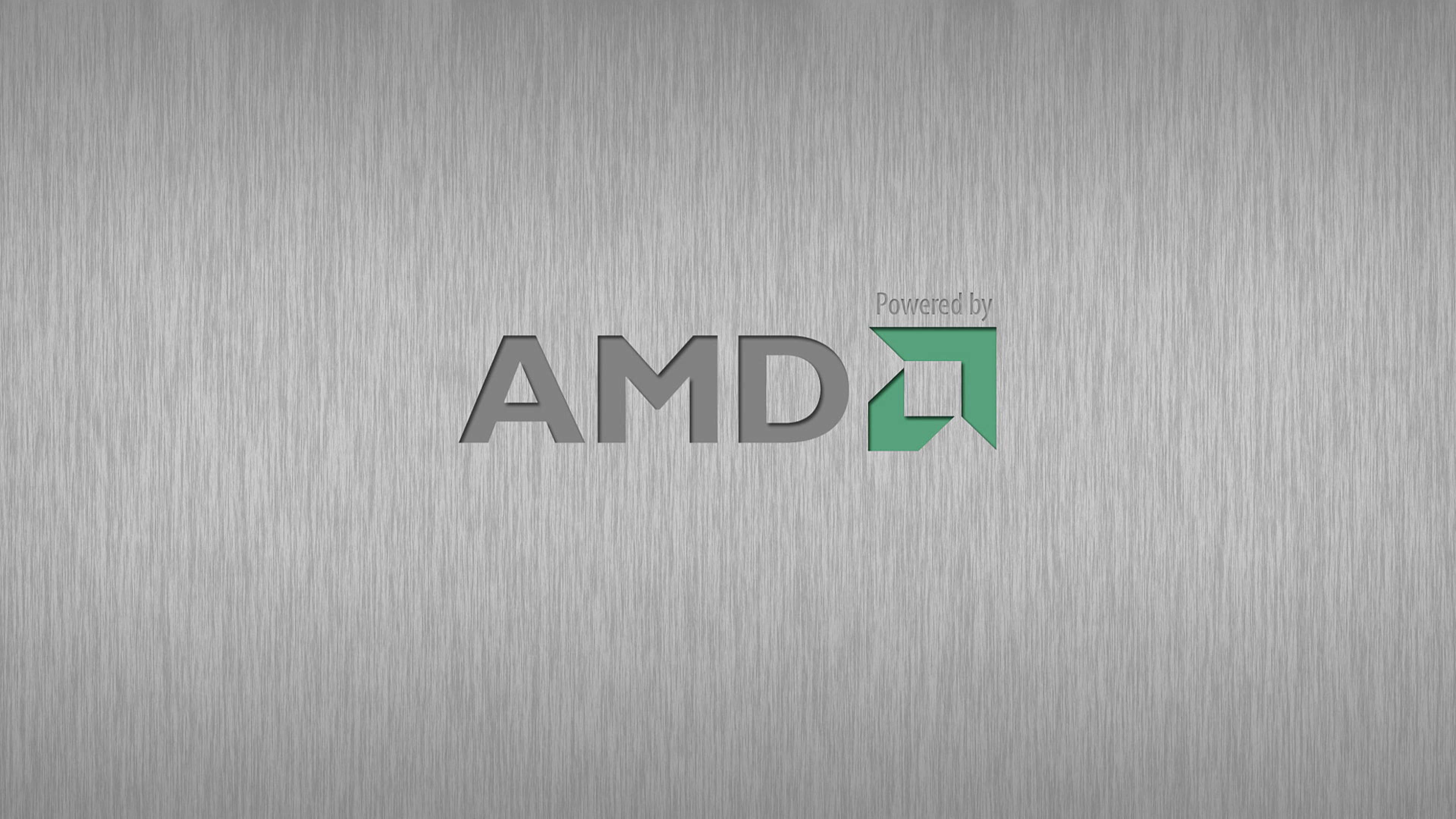 4K 桌布 壁紙 — AMD 標誌以灰色和綠色居中顯示在拉絲金屬紋理背景上。