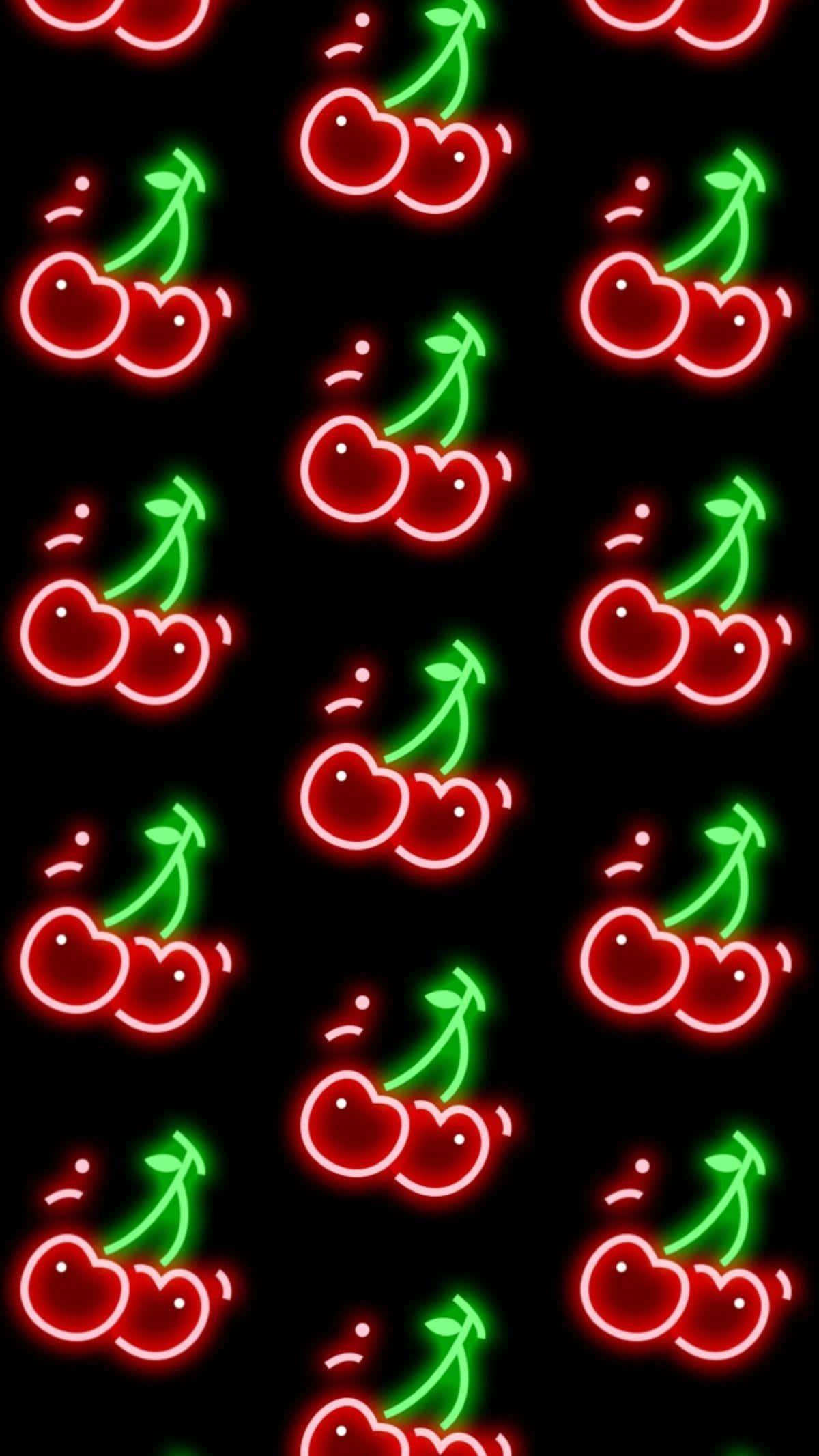 時尚 AMOLED 樱桃無縫 iPhone 壁紙 — 鮮豔的霓虹紅色和綠色櫻桃在黑色背景上以重複圖案發光。