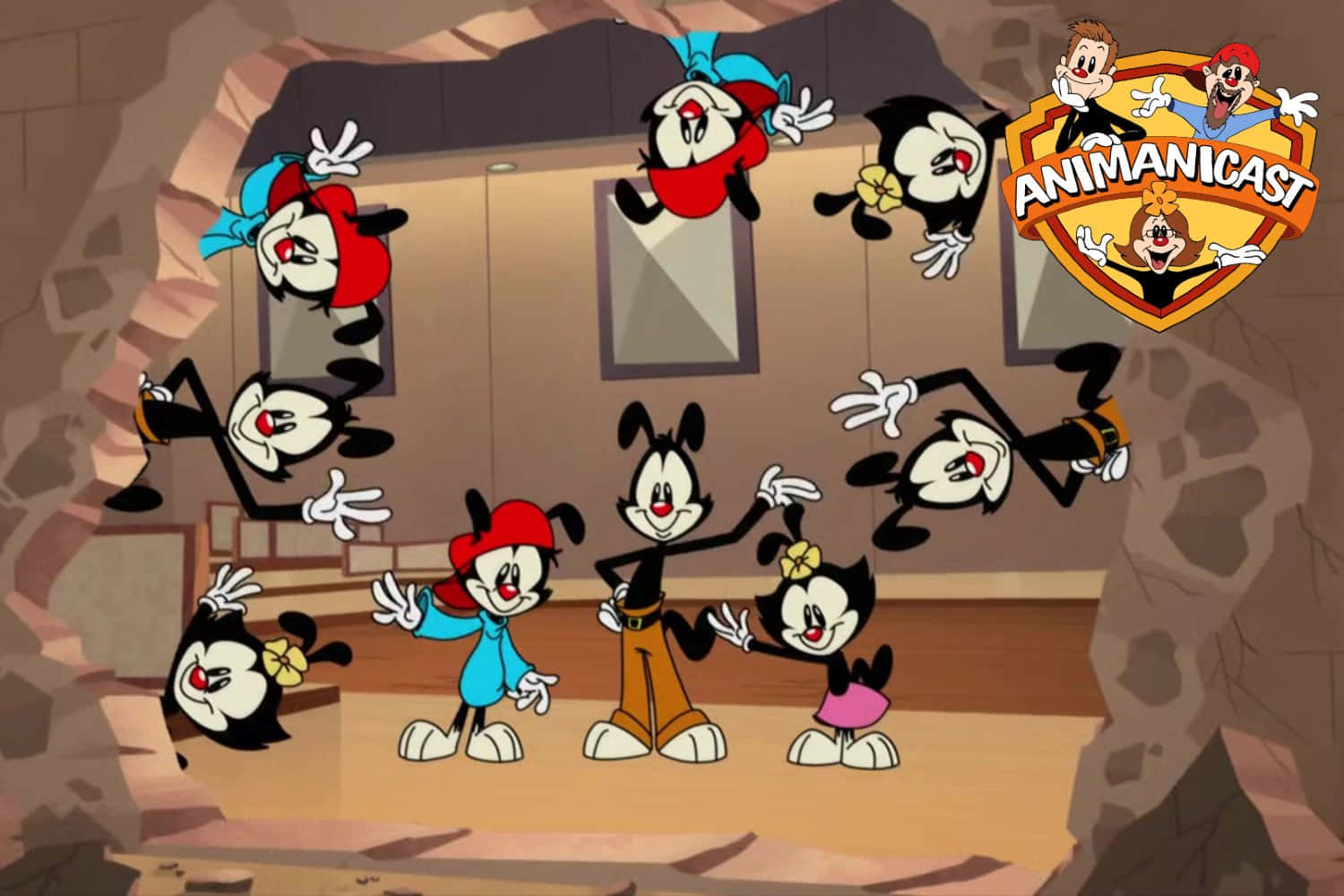 「Animaniacs 集體出發，展開新冒險！」 壁紙 — 洞穴中的卡通角色，有多個漂浮的自己版本和一個Animaniacs標誌。