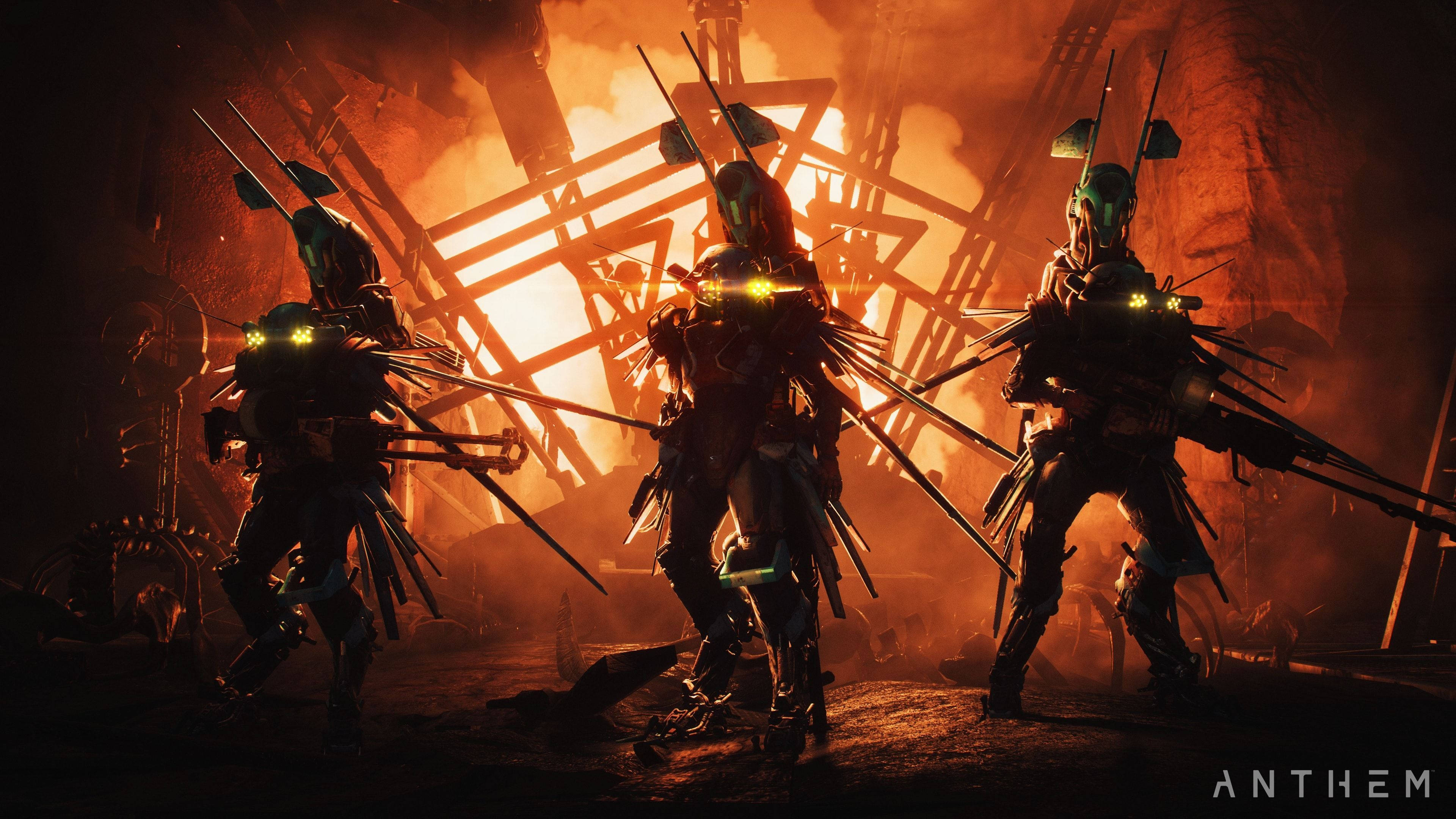 兩名勇敢的矛兵士兵，奮勇衝鋒為《Anthem》而戰 壁紙 — 三名身穿盔甲、眼睛發光的戰士站在燃燒的廢墟中，手持長矛，在橙色燈光下。