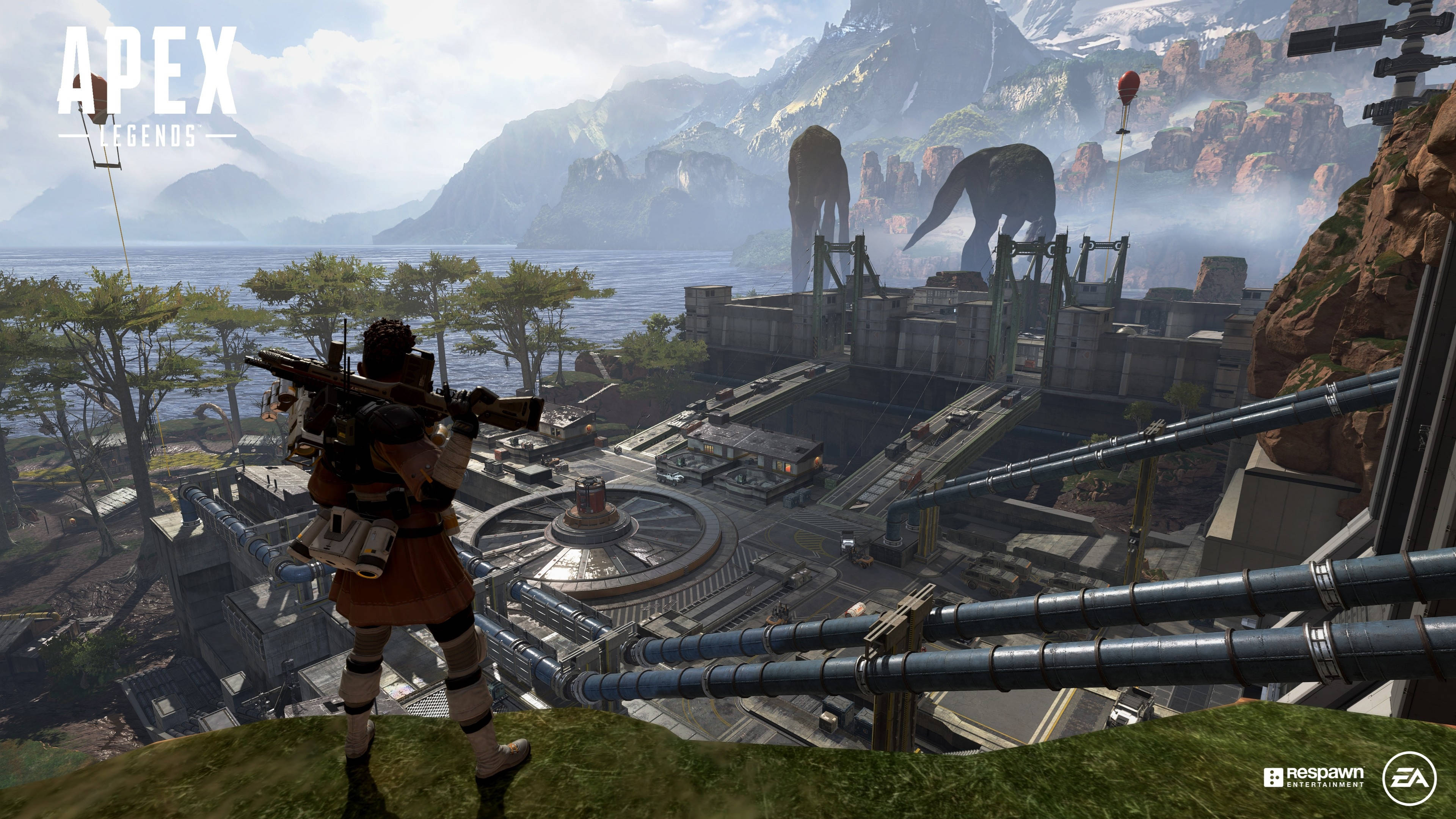 Apex Legends 4K 部隊營地 壁紙 — Apex Legends 中的玩家俯瞰著一個坐落於山脈與海洋之間的廣闊工業綜合體，遠處有巨大的機械野獸。