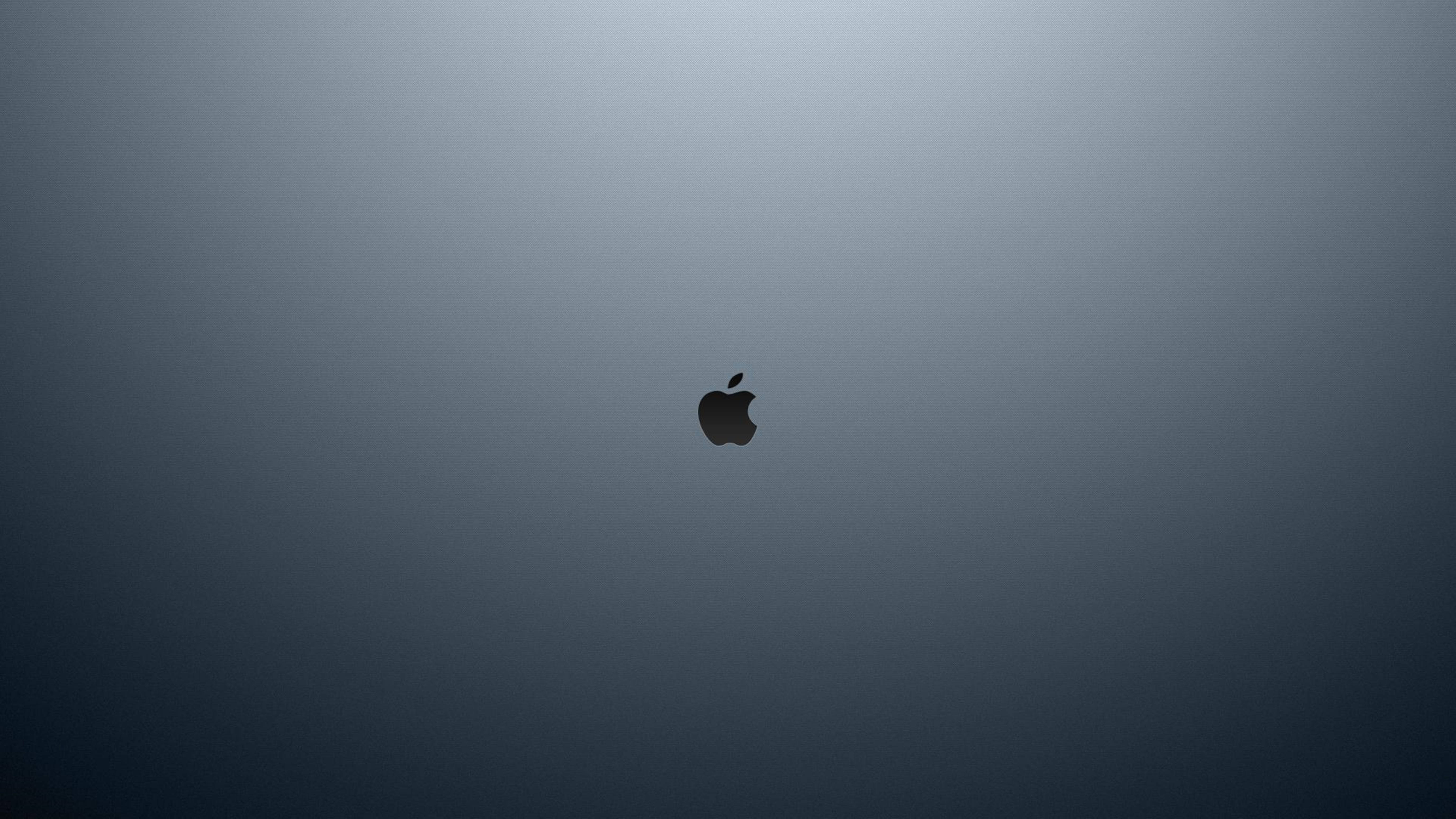 黑色 Apple 標誌清潔 4K 壁紙 — 一個極簡的深色漸變背景，中央有一個黑色的Apple標誌。