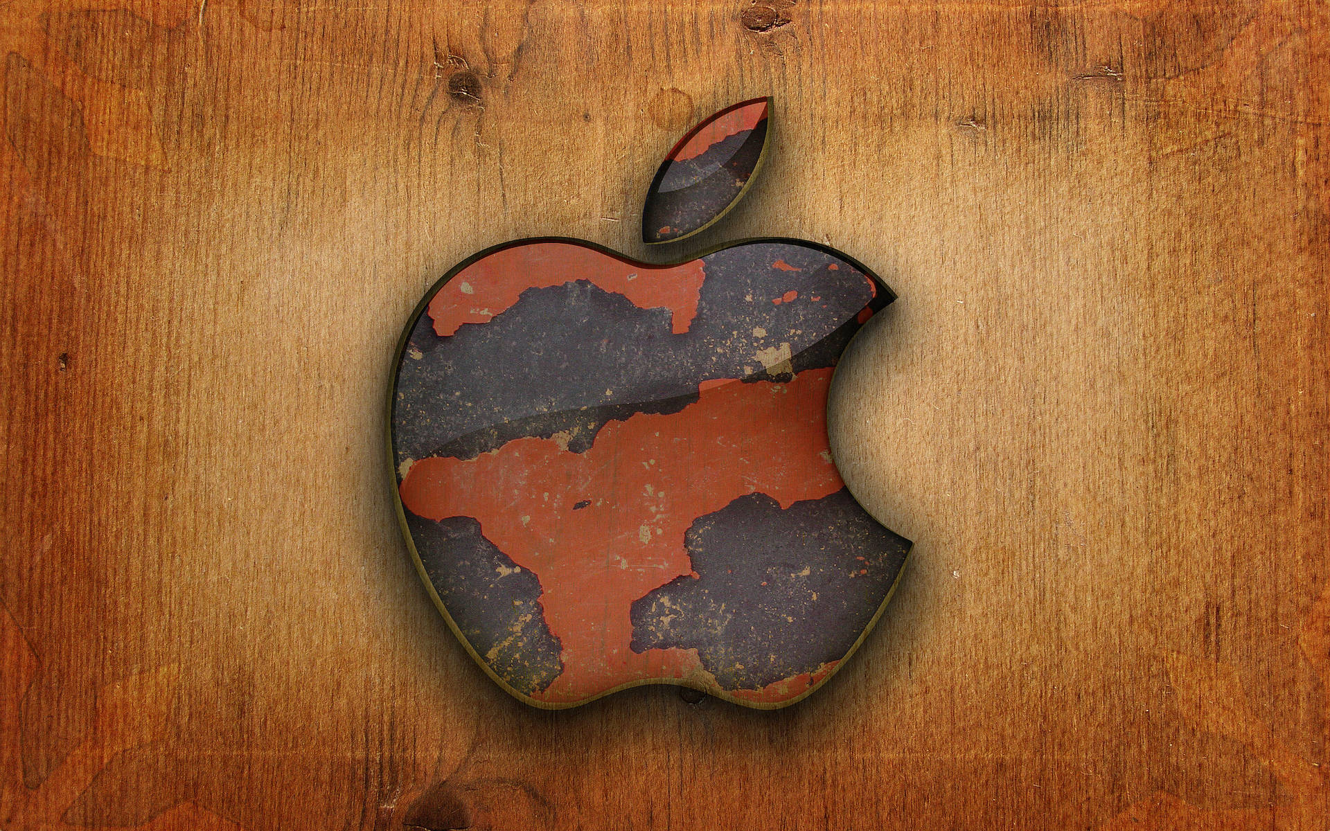 木質背景上油漆剝落的磨損Apple標誌。