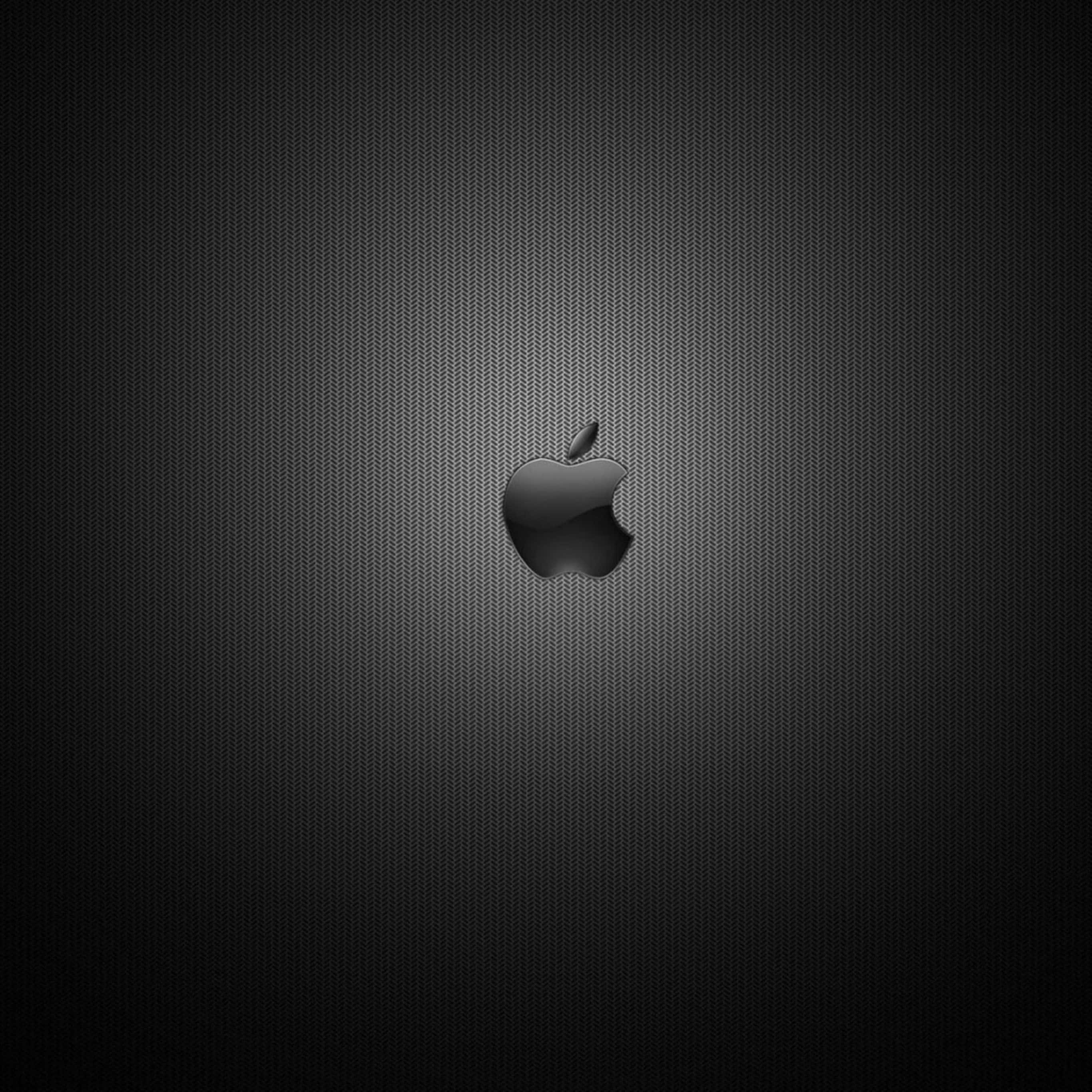 黑色背景 Apple 標誌 iPad 壁紙 — 一個時尚的黑色Apple標誌，居中於帶紋理的深灰色漸變背景上。
