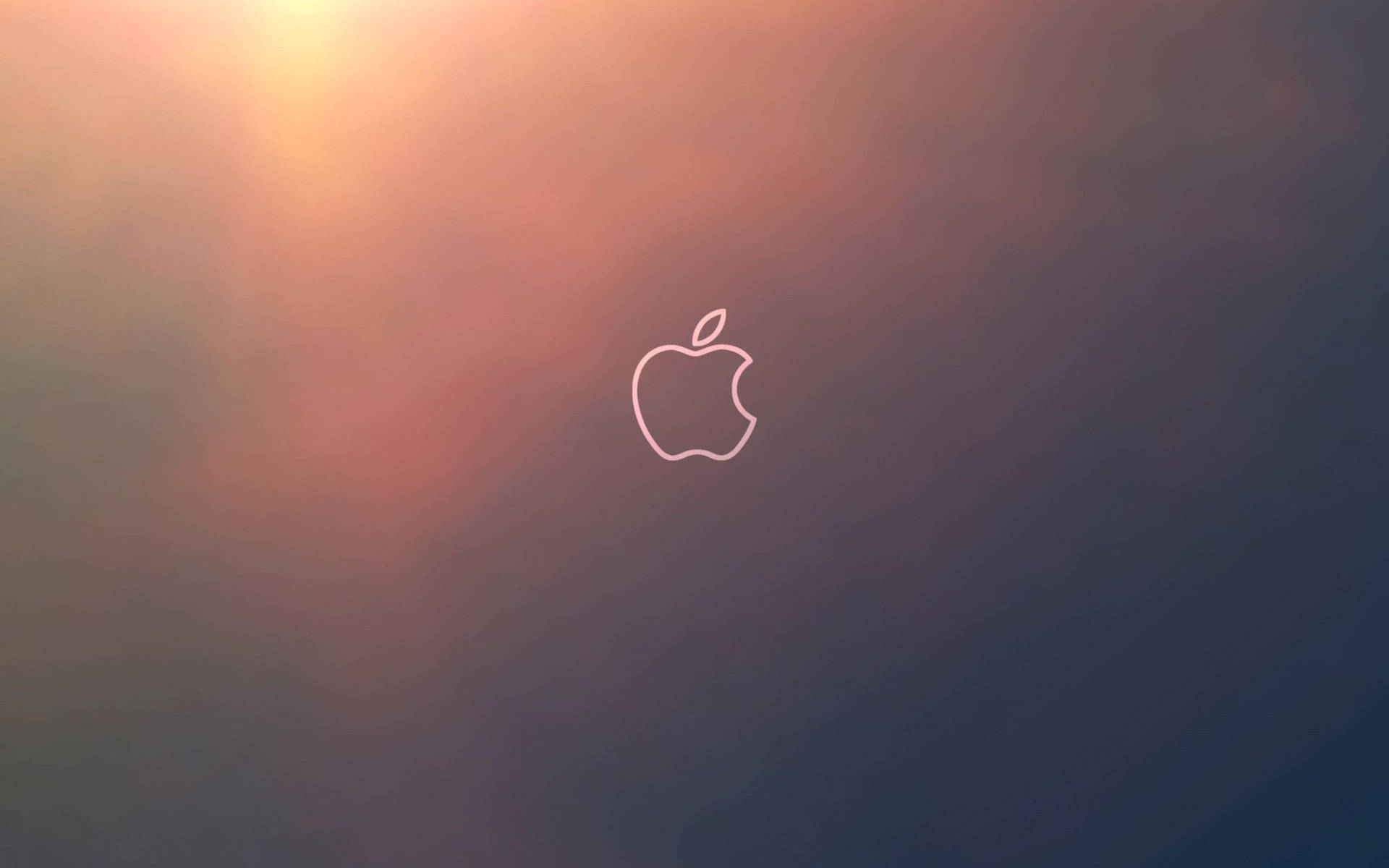 Apple標誌輪廓在日落漸變背景上發光。
