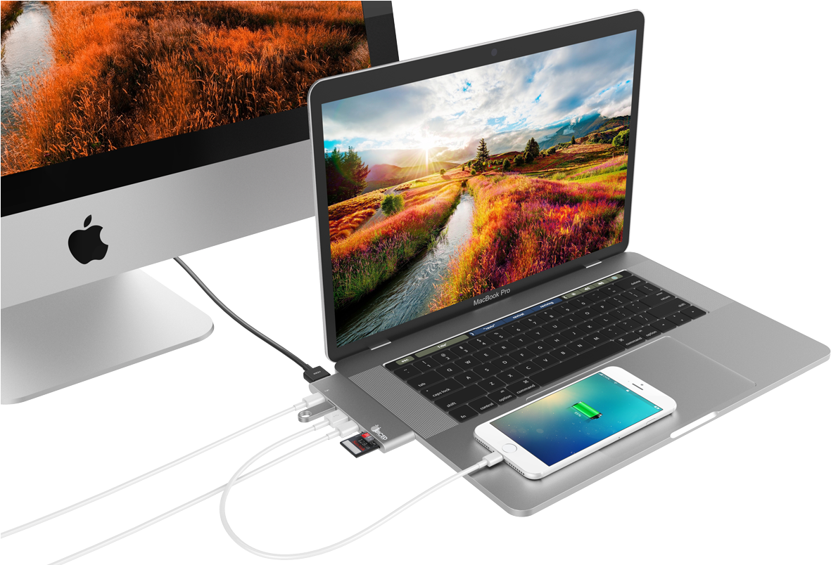Apple MacBook Pro 與 iPhone 及 iMac 組合 壁紙 — 時尚的筆記型電腦和顯示器顯示出色彩繽紛的田野上蜿蜒河流的鮮豔日落。
