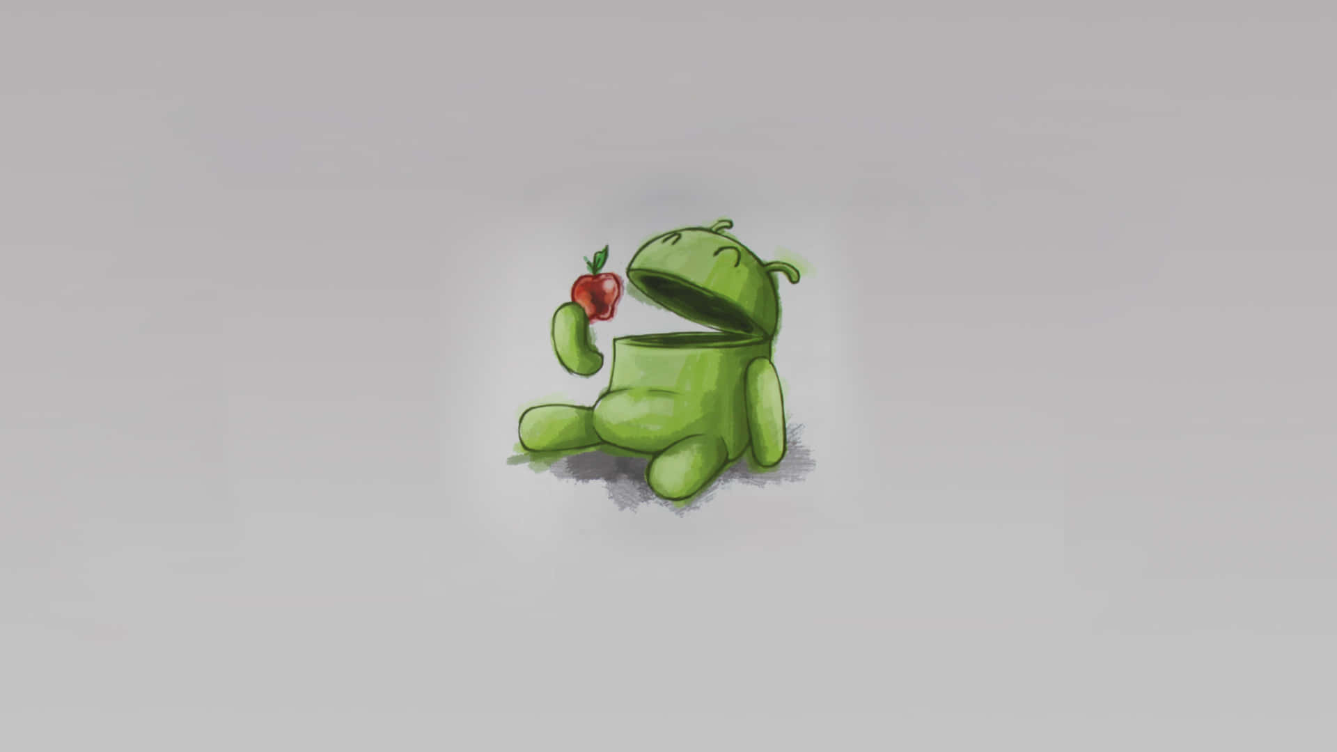 綠色Android吉祥物在灰色背景上拿著紅蘋果