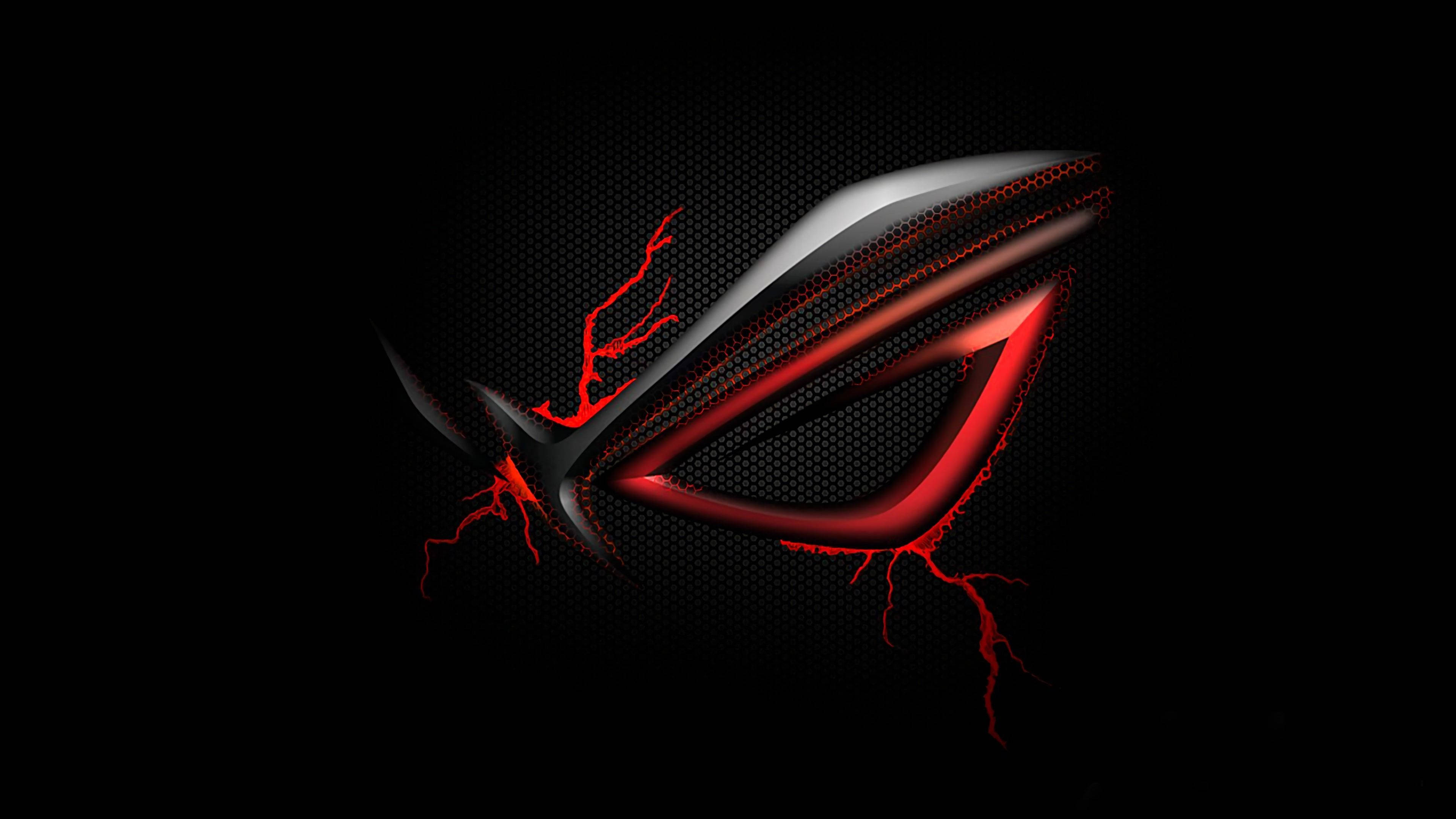 ASUS ROG 4K 遊戲標誌配紅色閃電 壁紙 — 一個發光的紅色和銀色風格化眼睛標誌，帶有電火花，背景為深色紋理。