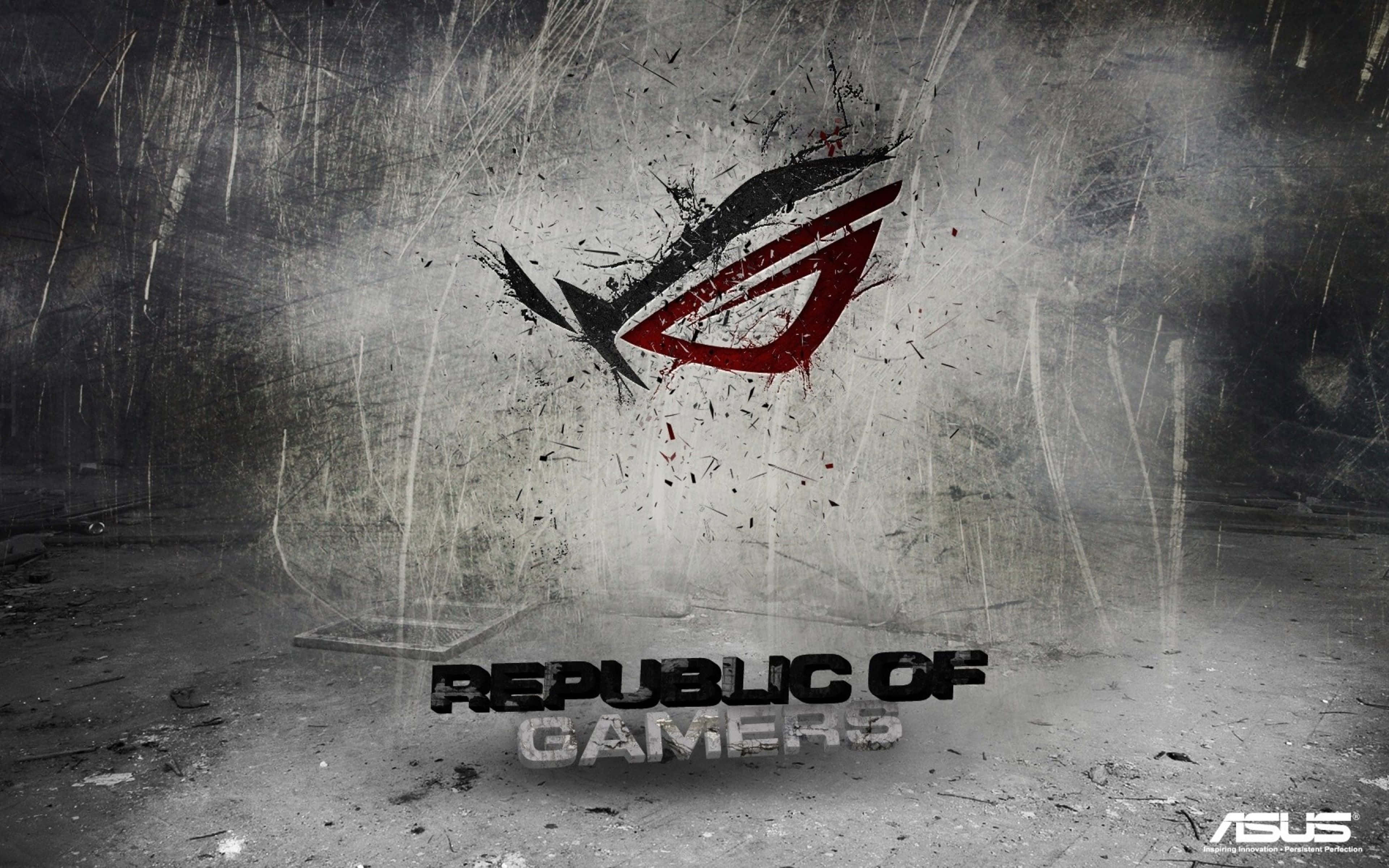 ASUS ROG：集力量與精準於一身 壁紙 — 粗糙紋理的牆壁上有一個大膽的紅黑ROG標誌，周圍有飛濺的油漆和刮痕，環繞著Republic of Gamers文字。