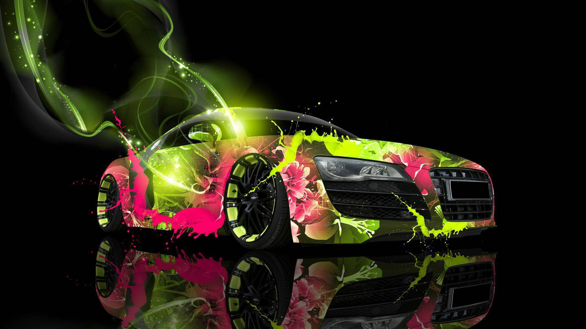 酷炫Audi R8 Spyder 壁紙 — 一輛時尚跑車飾有螢光綠色和粉紅色花卉潑濺，在帶有反光表面的黑色背景上發光。