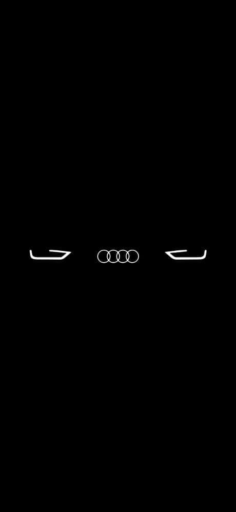 黑暗中發光的 Audi 汽車標誌和頭燈。 — 奧迪 GIF 壁紙