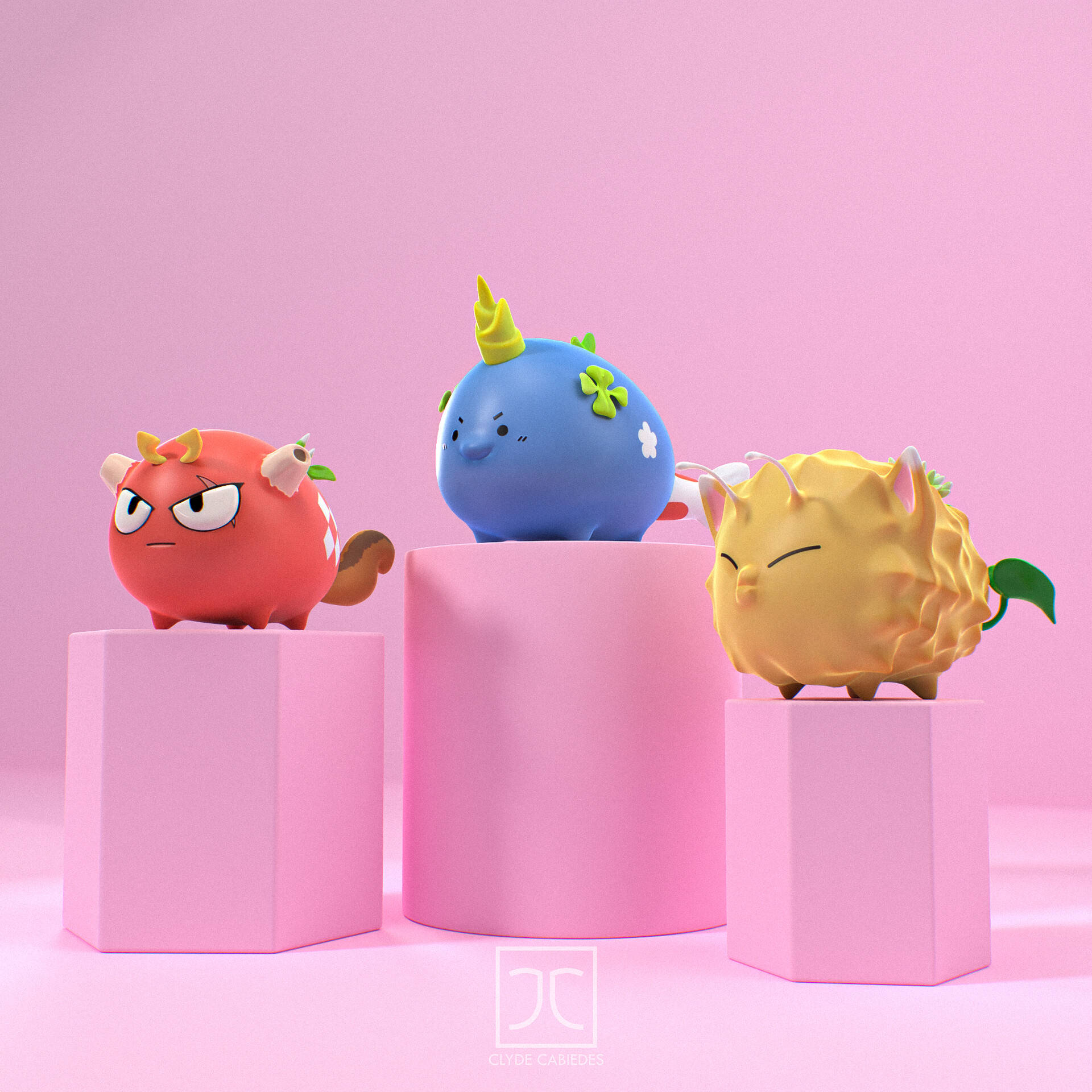 Axie Infinity 角色手辦 壁紙 — 三個可愛的卡通生物，分別是紅色、藍色和黃色，坐在粉紅色底座上，背景是柔和的粉紅色。