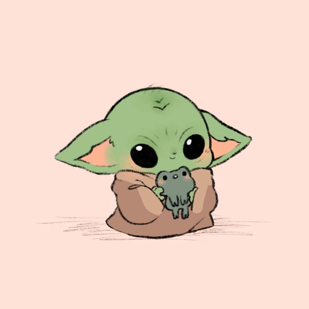 可愛Baby Yoda攜帶Sorgan青蛙照片 壁紙 — 一個可愛的綠色嬰兒尤達角色在柔和的粉紅色背景前擁抱一隻小灰色青蛙。