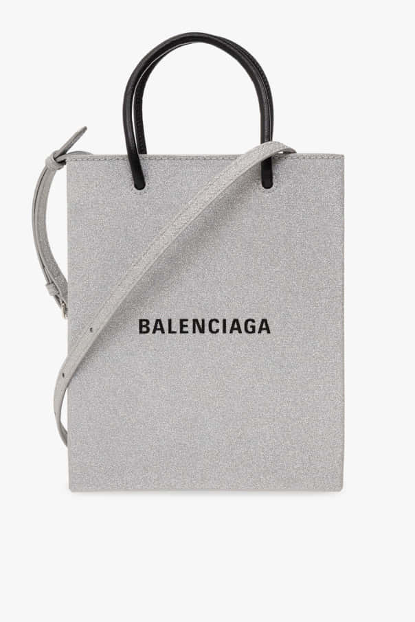 灰色Balenciaga手提袋，配有黑色手柄和肩帶。