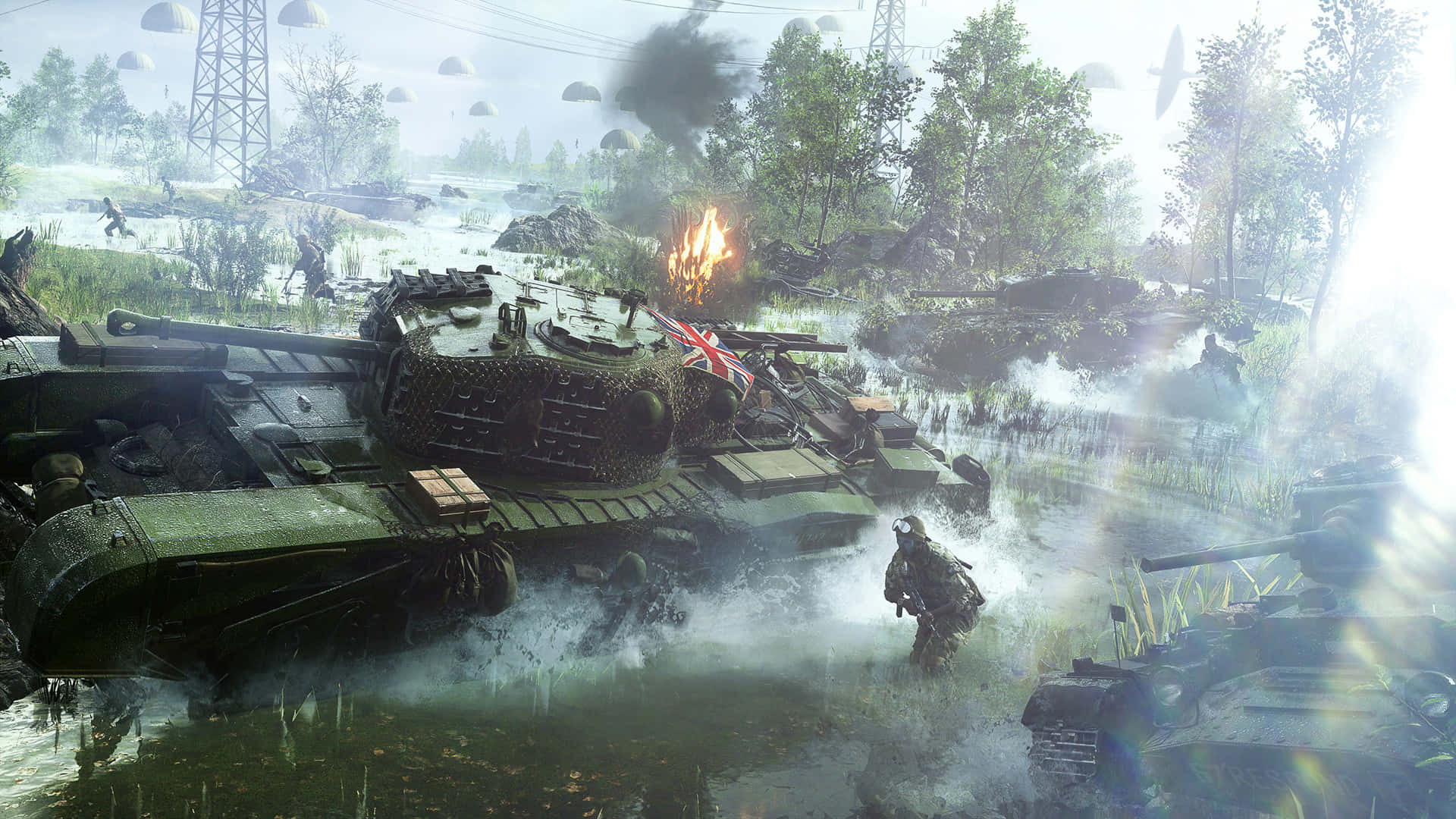 Battlefield V 即將爆發的戰爭 壁紙 — 戰士們在明亮的陽光下，穿越泥濘的戰場，燃燒的坦克和升起的煙霧。